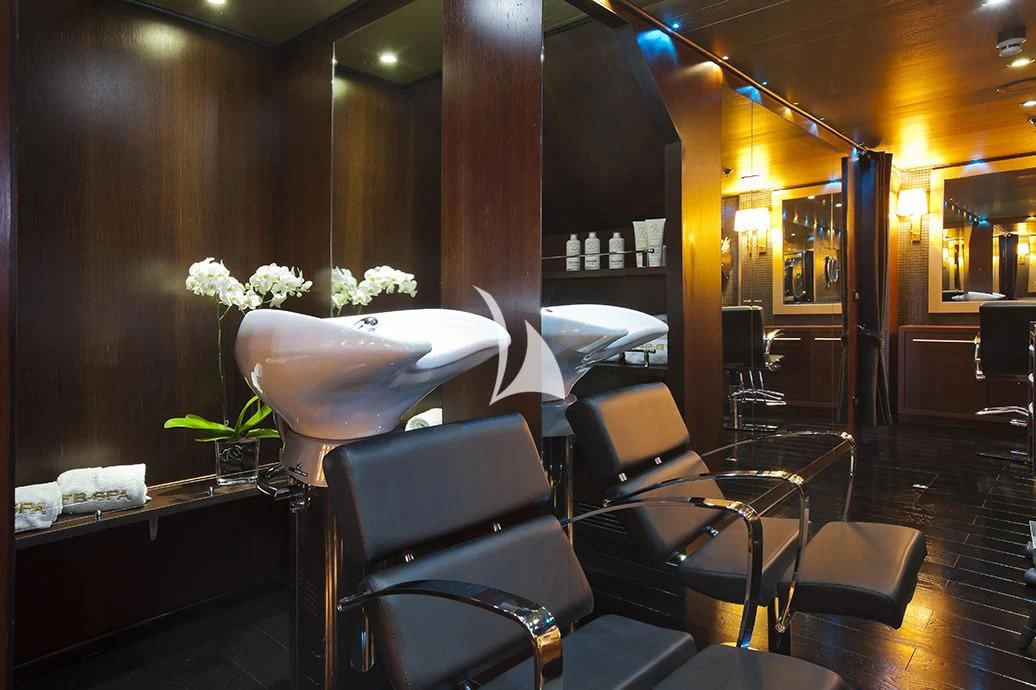 a room with tables and chairs aboard FORCE BLUE Yacht for Charter