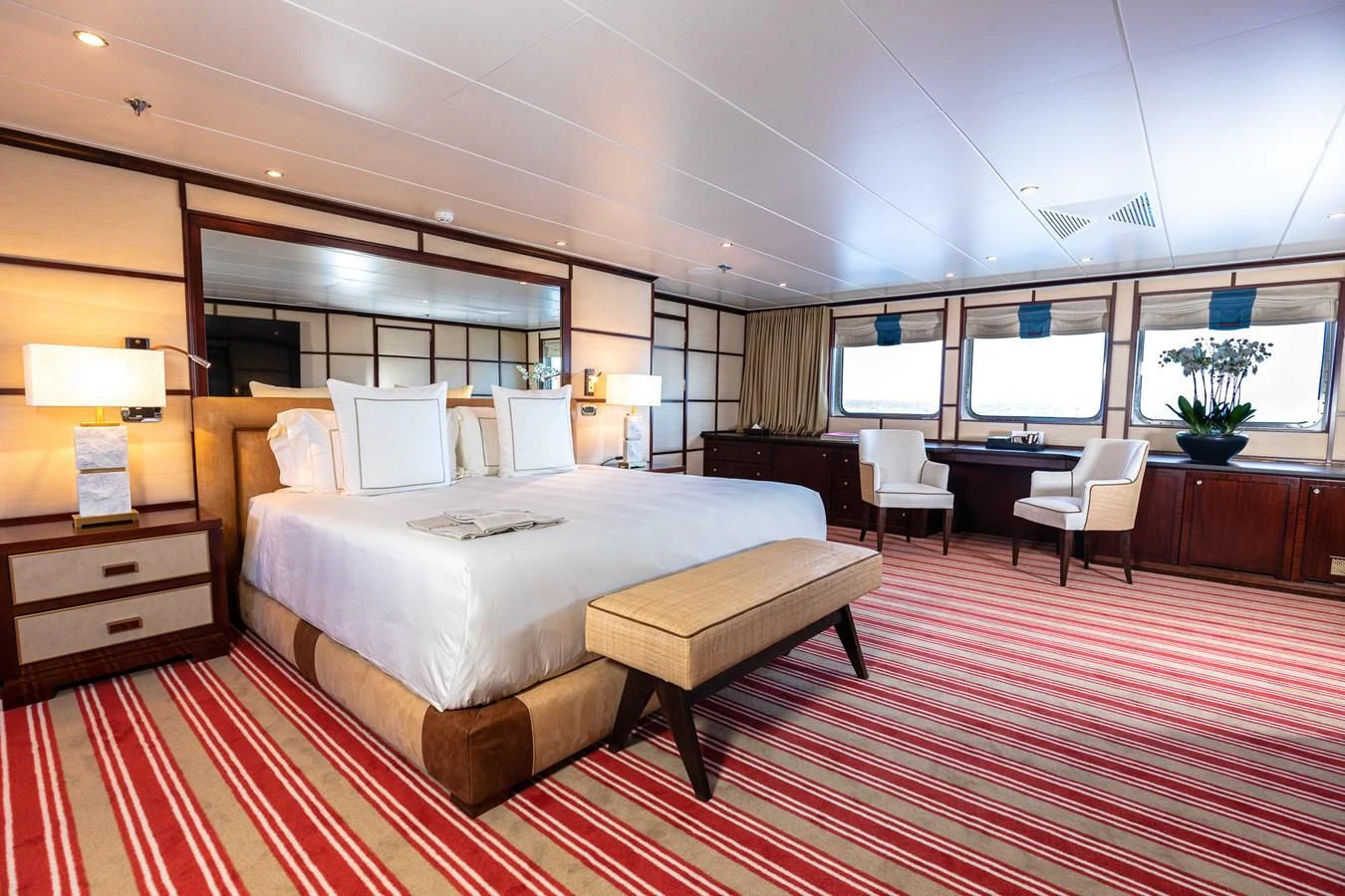 a hotel room with a bed and a large window aboard FORCE BLUE Yacht for Charter
