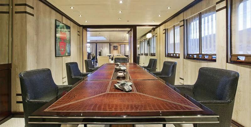 a conference room with a table and chairs aboard FORCE BLUE Yacht for Charter