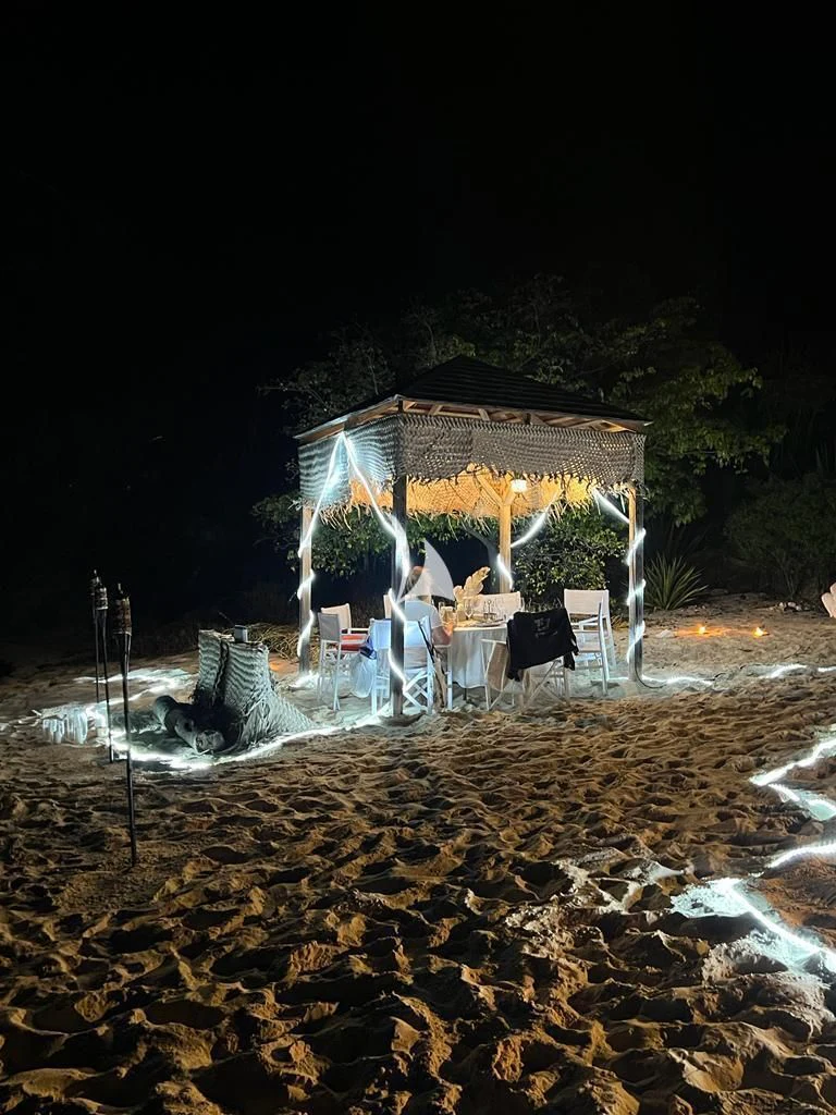 a house with a group of chairs outside at night aboard FORCE BLUE Yacht for Charter