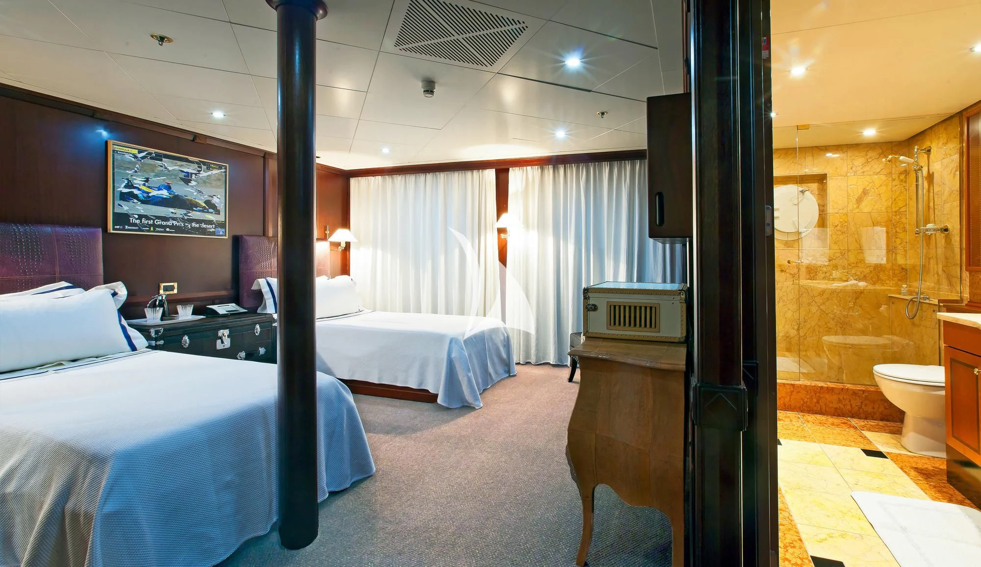 a room with beds and a window aboard FORCE BLUE Yacht for Charter