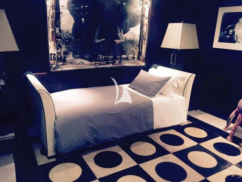 a bed with a white sheet aboard FORCE BLUE Yacht for Charter