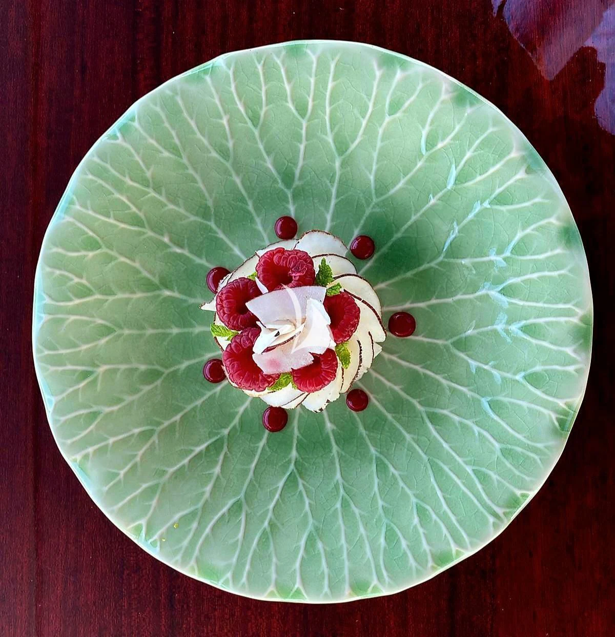 a plate with a flower on it aboard FORCE BLUE Yacht for Charter