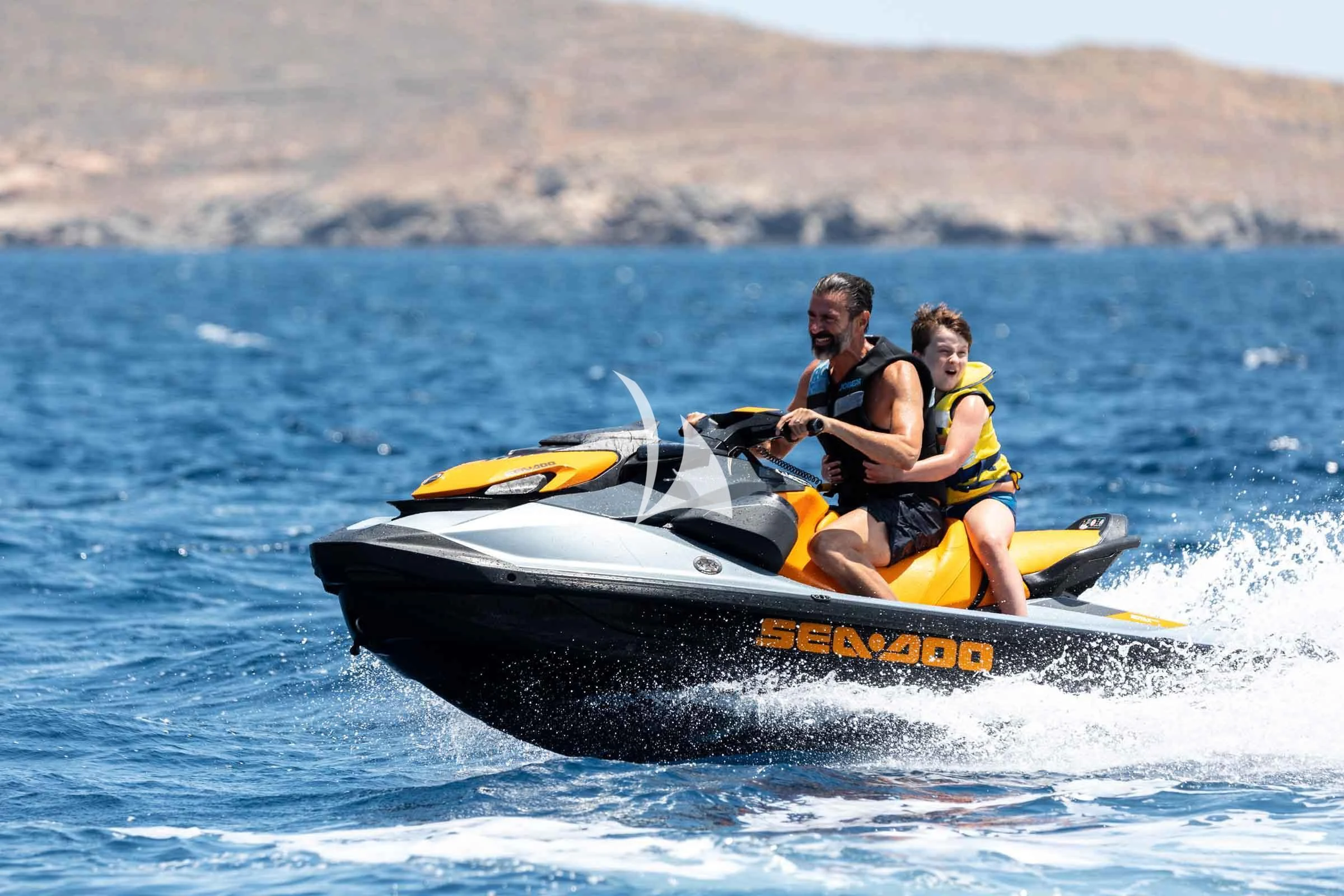 a man and a woman in a speedboat on the water aboard FORCE BLUE Yacht for Charter