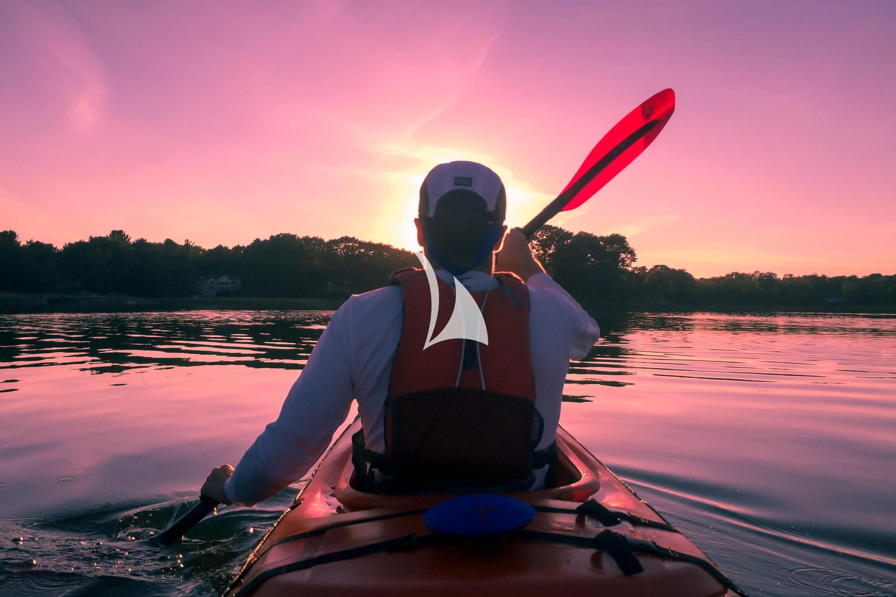 a man paddling a canoe aboard FORCE BLUE Yacht for Charter