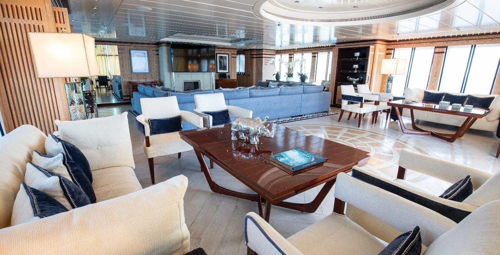 a living room with a table and chairs aboard FORCE BLUE Yacht for Charter