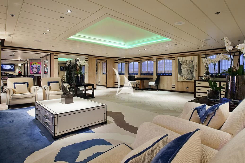 a living room with a large white table and chairs aboard FORCE BLUE Yacht for Charter