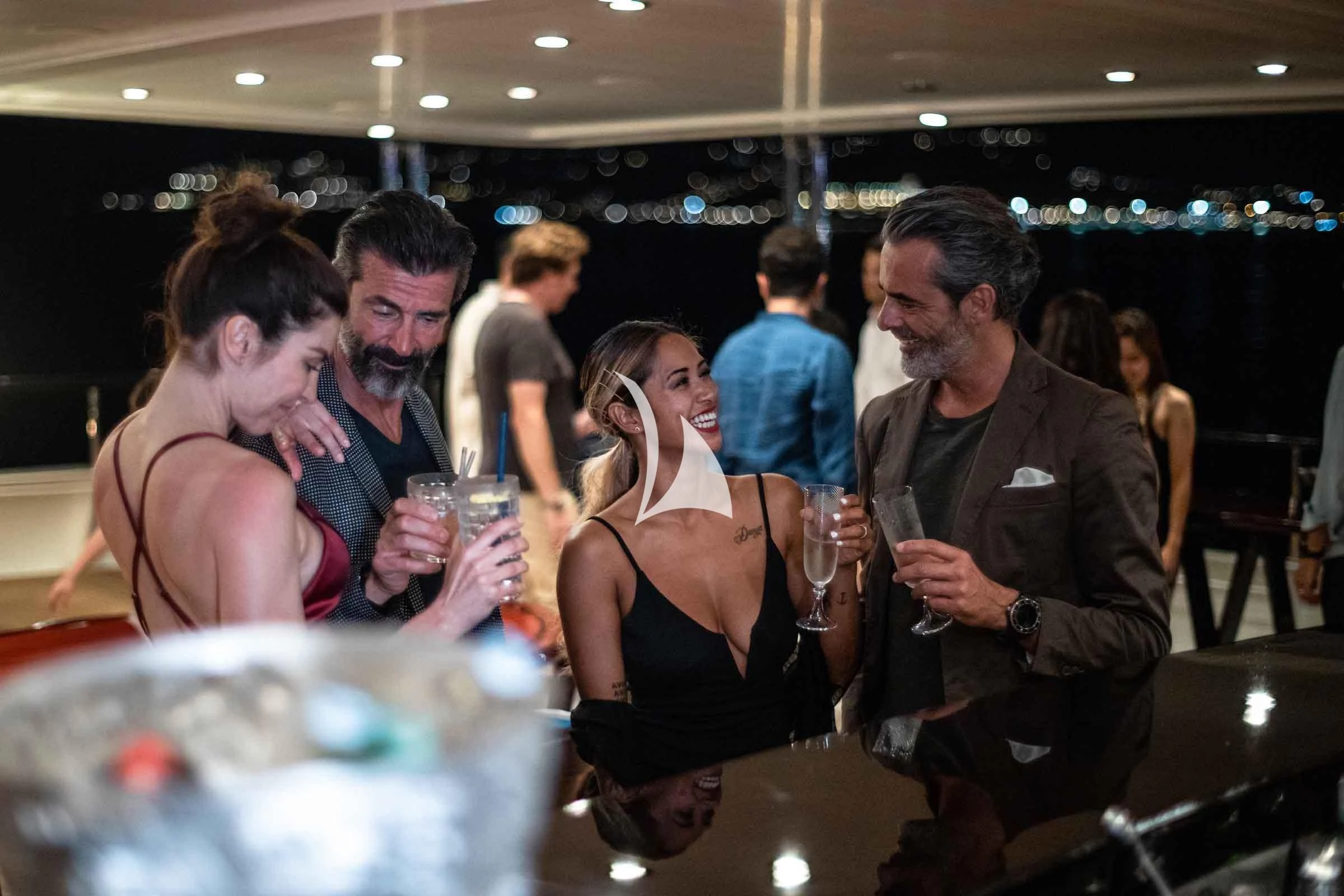 a group of people at a bar aboard FORCE BLUE Yacht for Charter
