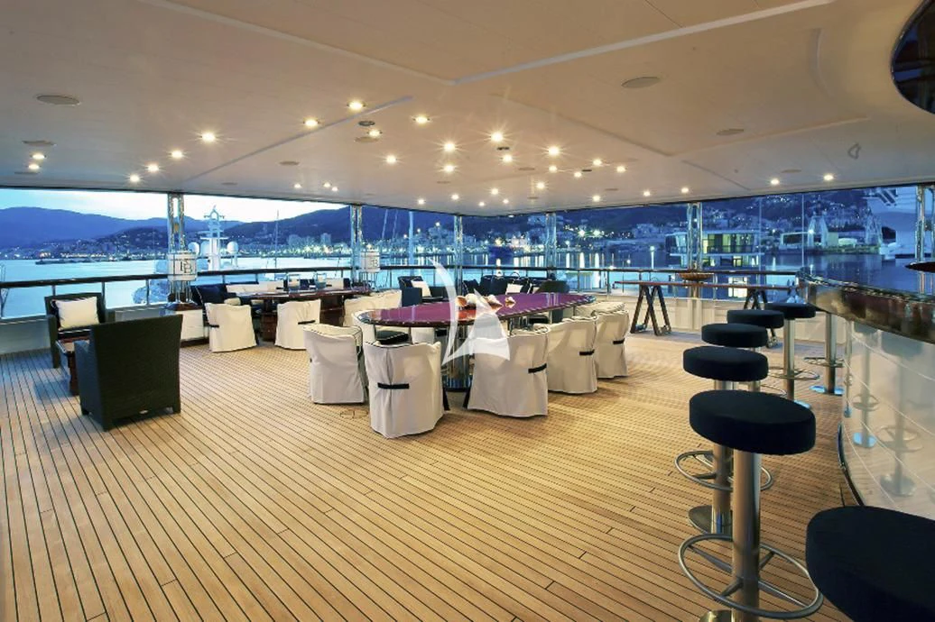 a room with tables and chairs aboard FORCE BLUE Yacht for Charter