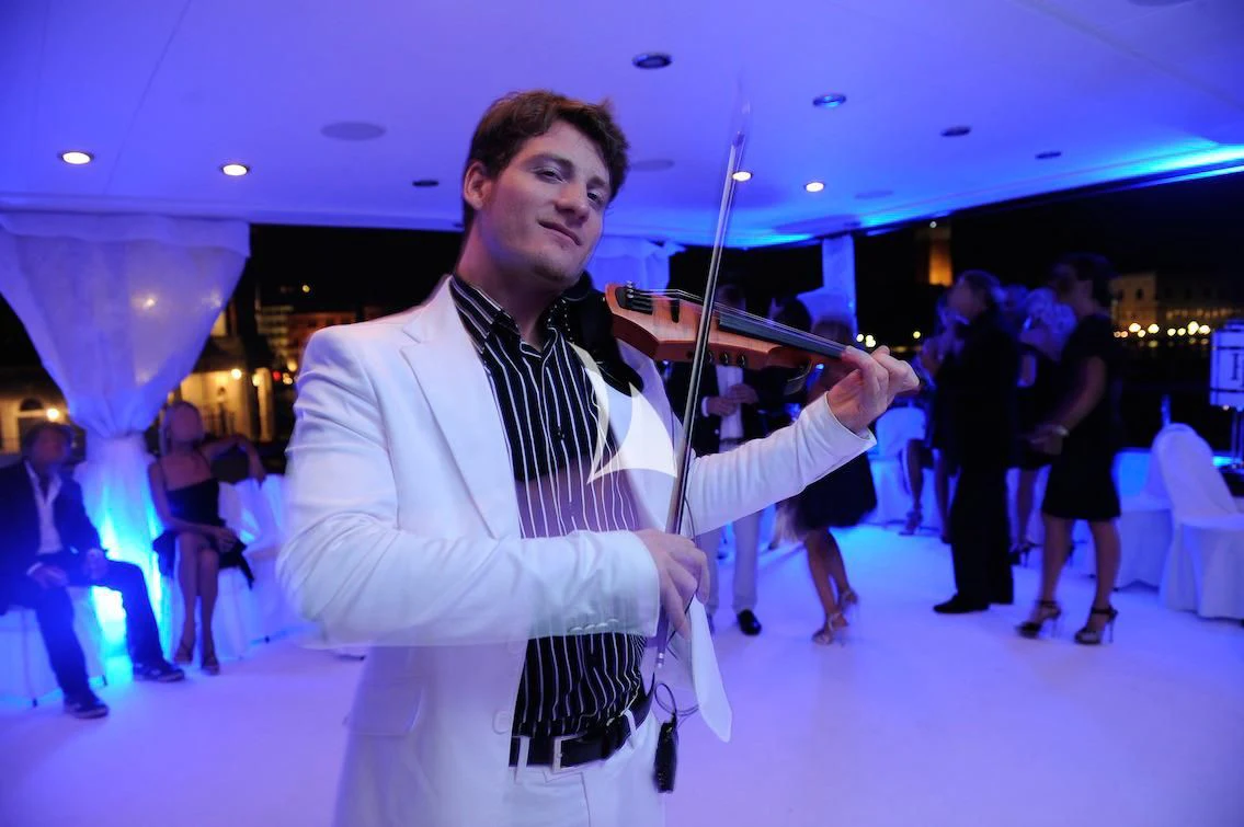 a man holding a sword aboard FORCE BLUE Yacht for Charter