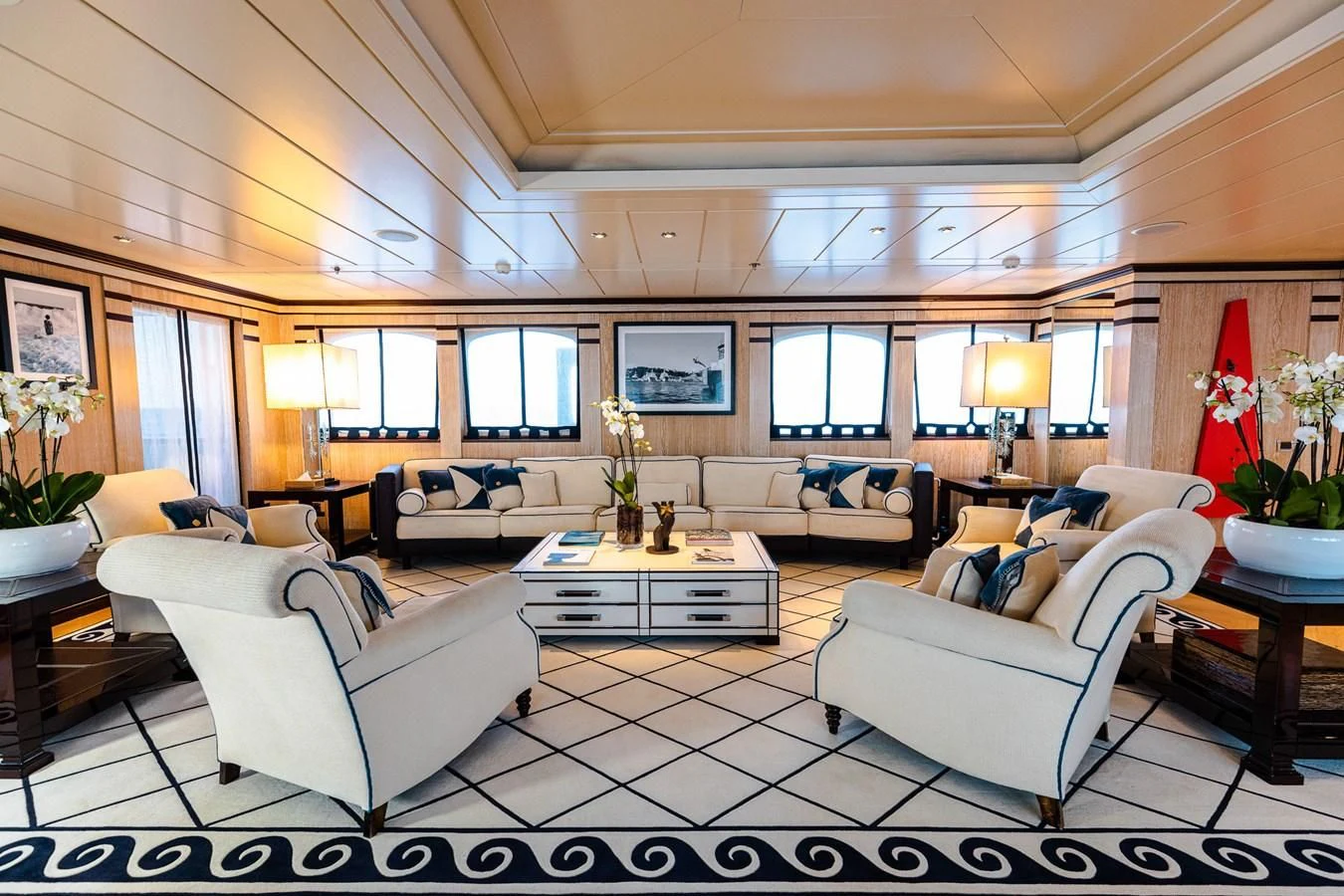 a living room with a white couch and a coffee table aboard FORCE BLUE Yacht for Charter