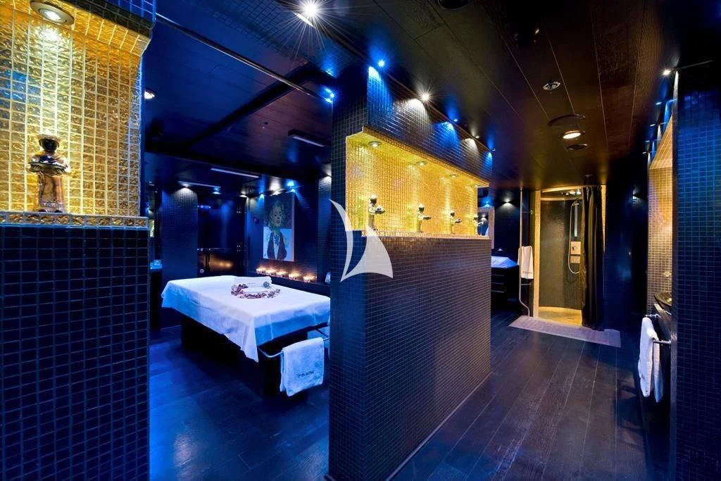 a room with a bed and a table aboard FORCE BLUE Yacht for Charter
