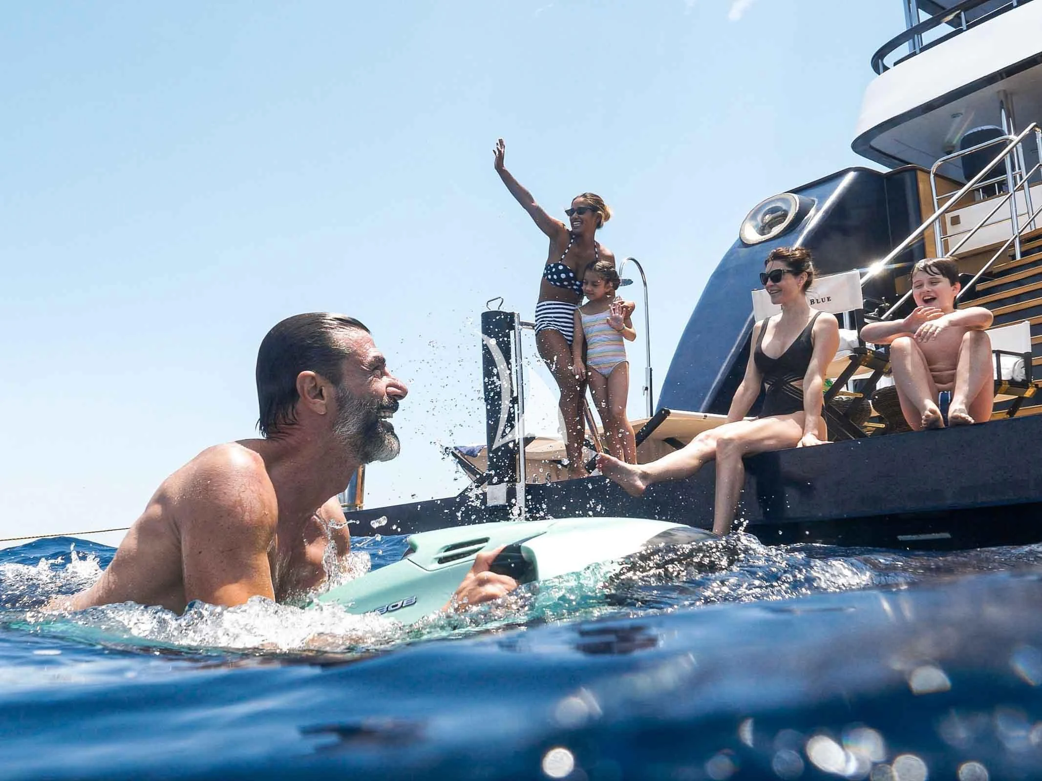 a group of people on a beach aboard FORCE BLUE Yacht for Charter