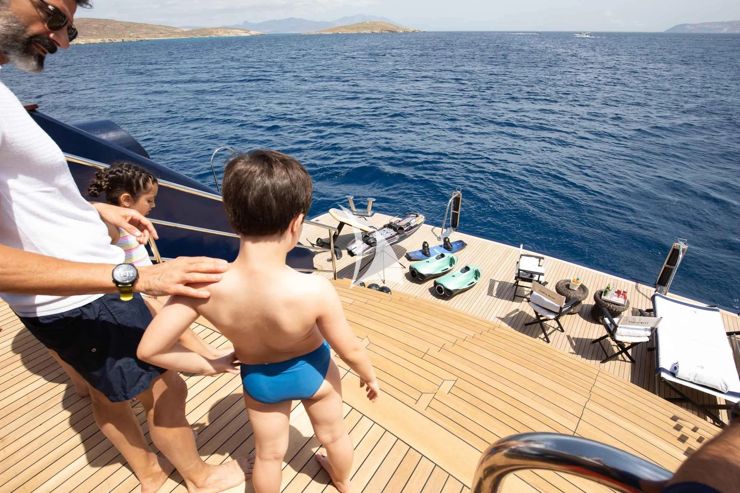 a person and a boy on a boat aboard FORCE BLUE Yacht for Charter