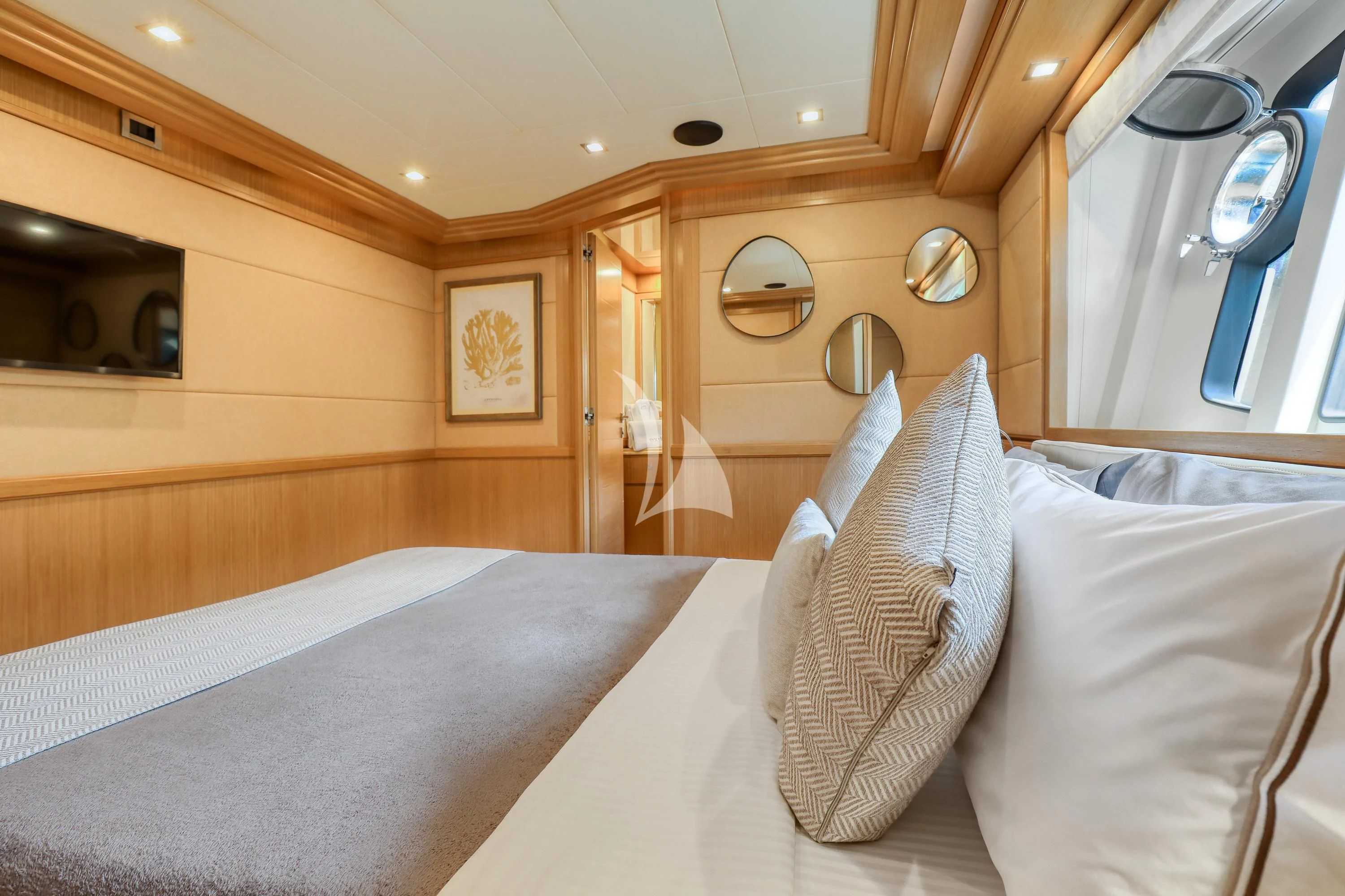a room with a bed and a mirror aboard EOLIA Yacht for Sale