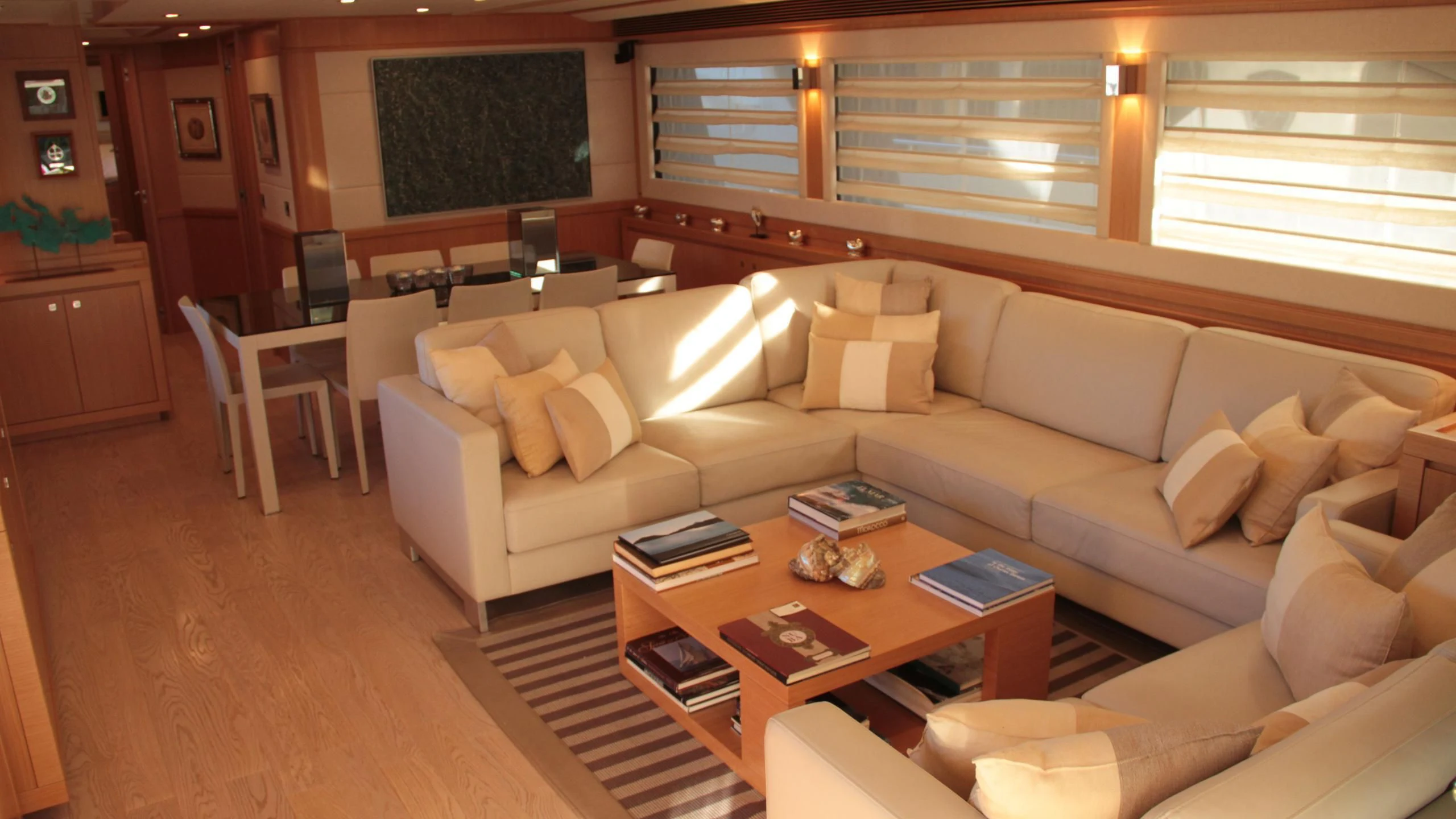 a living room with a couch and a coffee table aboard EOLIA Yacht for Sale