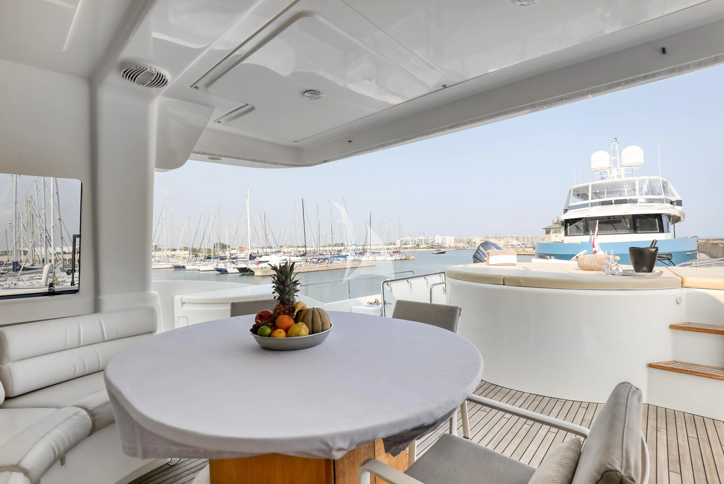 a table with a bowl of fruit on it aboard EOLIA Yacht for Sale