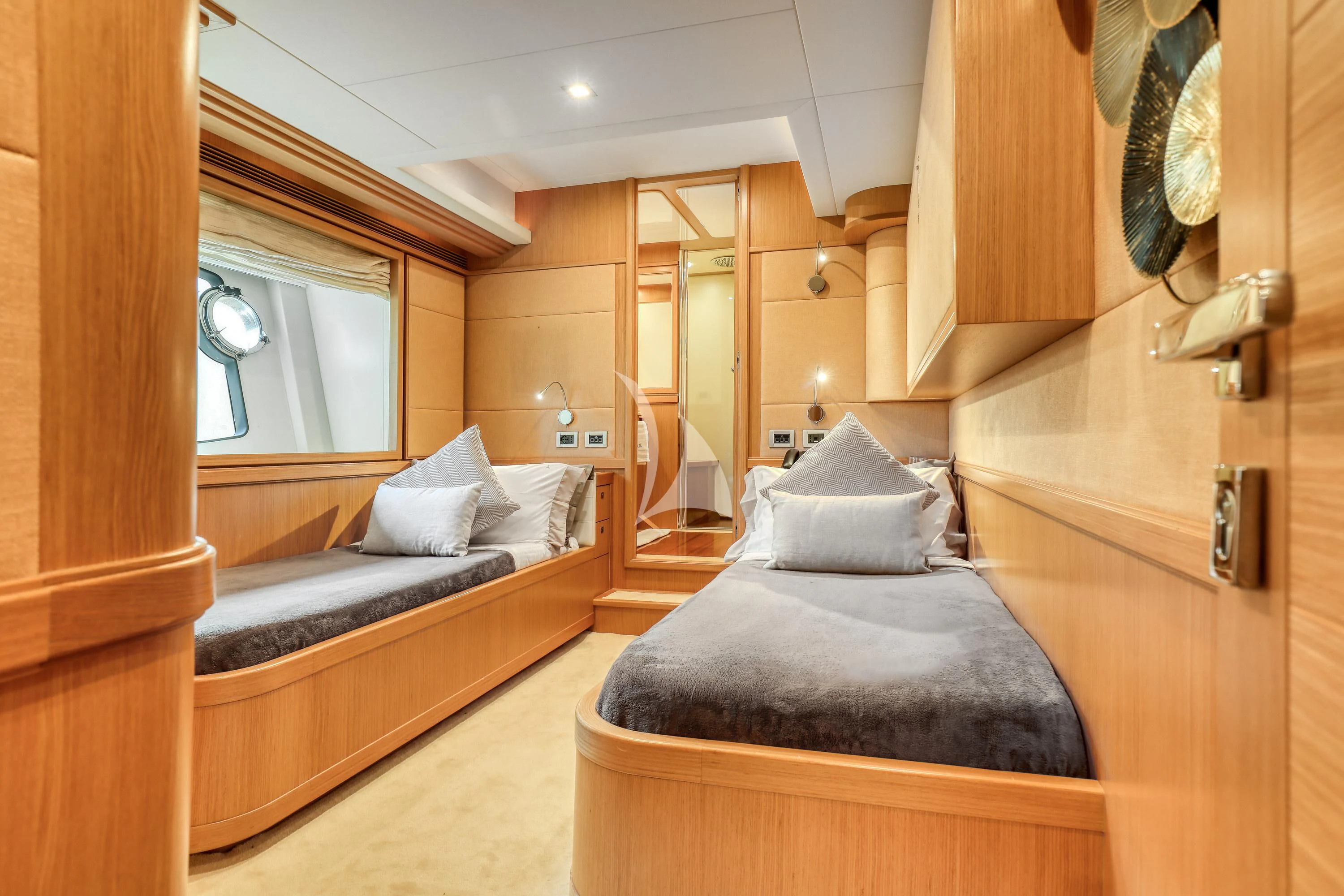 a bedroom with a bed and a mirror aboard EOLIA Yacht for Sale