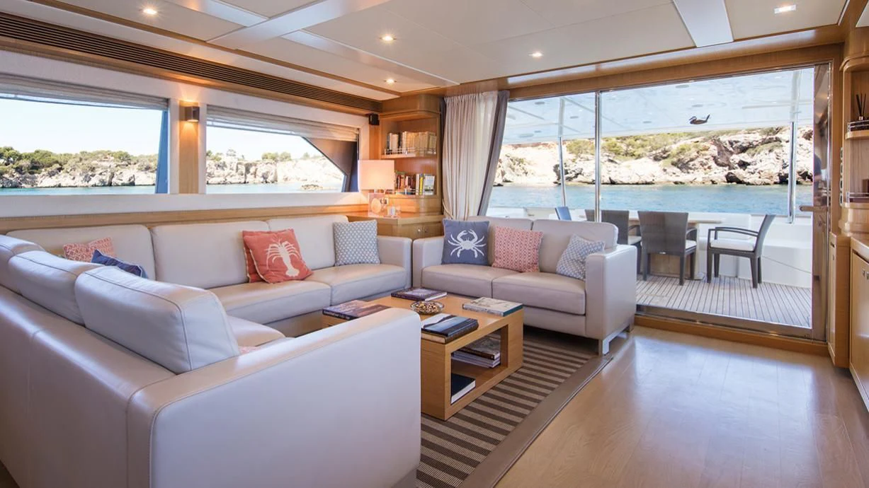 a living room with a large window aboard EOLIA Yacht for Sale