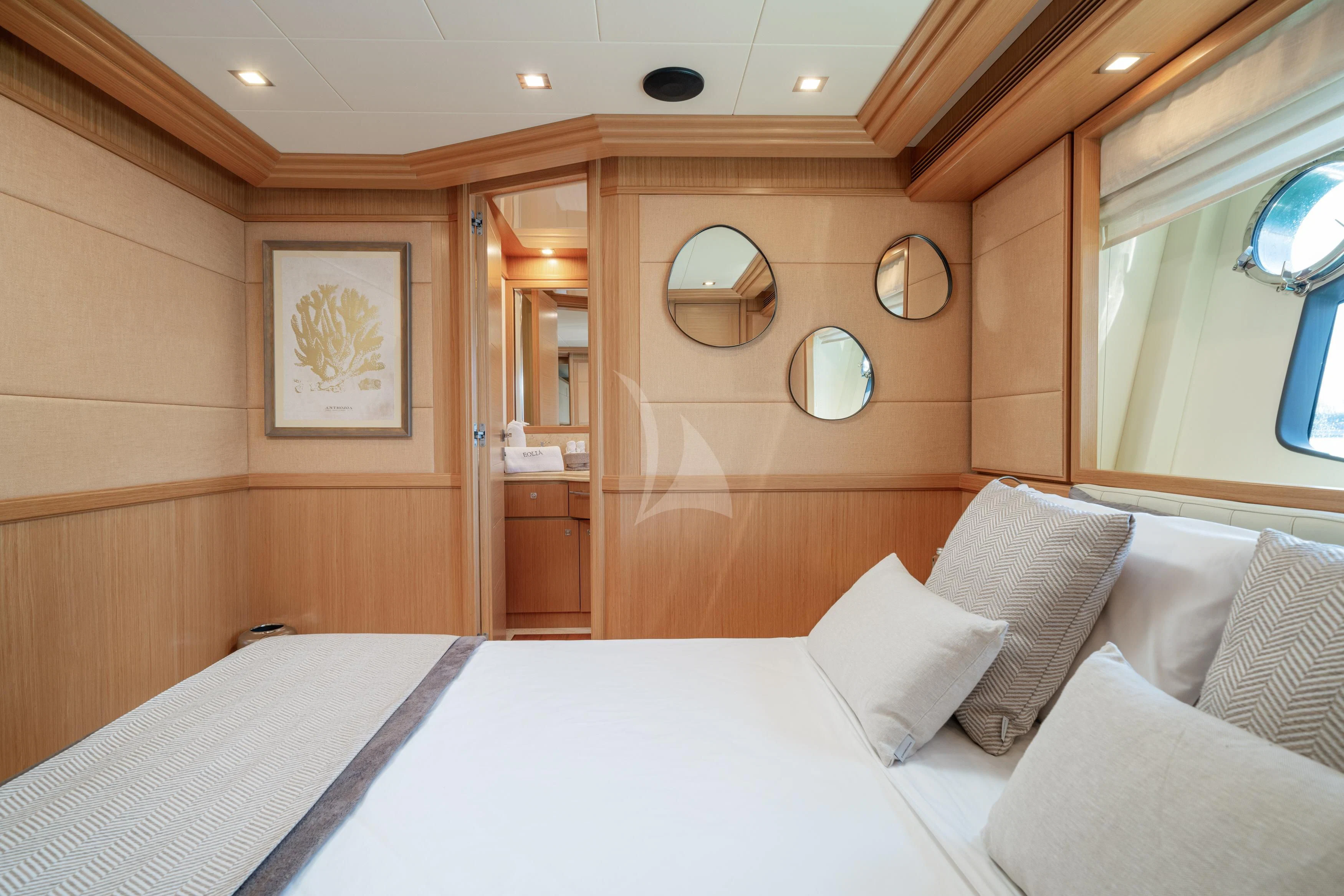 a bed with white sheets and pillows aboard EOLIA Yacht for Sale