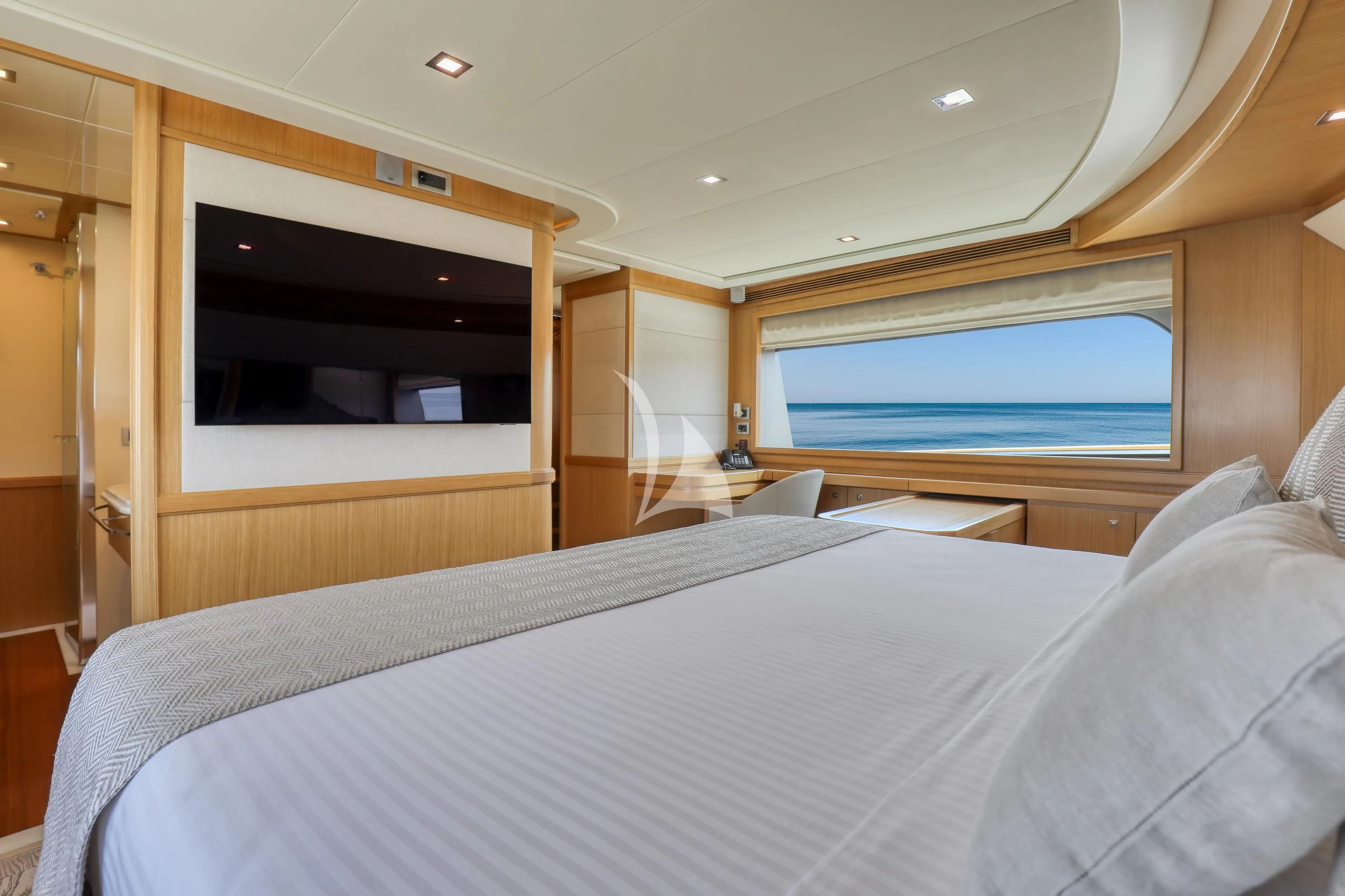 a bed with a white sheet aboard EOLIA Yacht for Sale