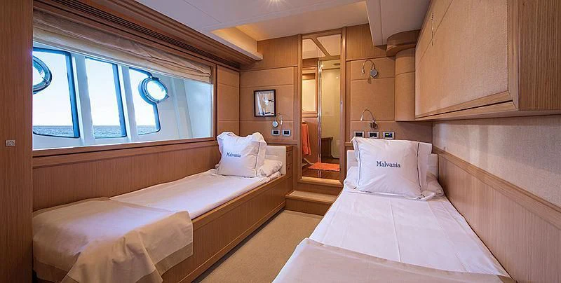 a room with beds and a window aboard EOLIA Yacht for Sale