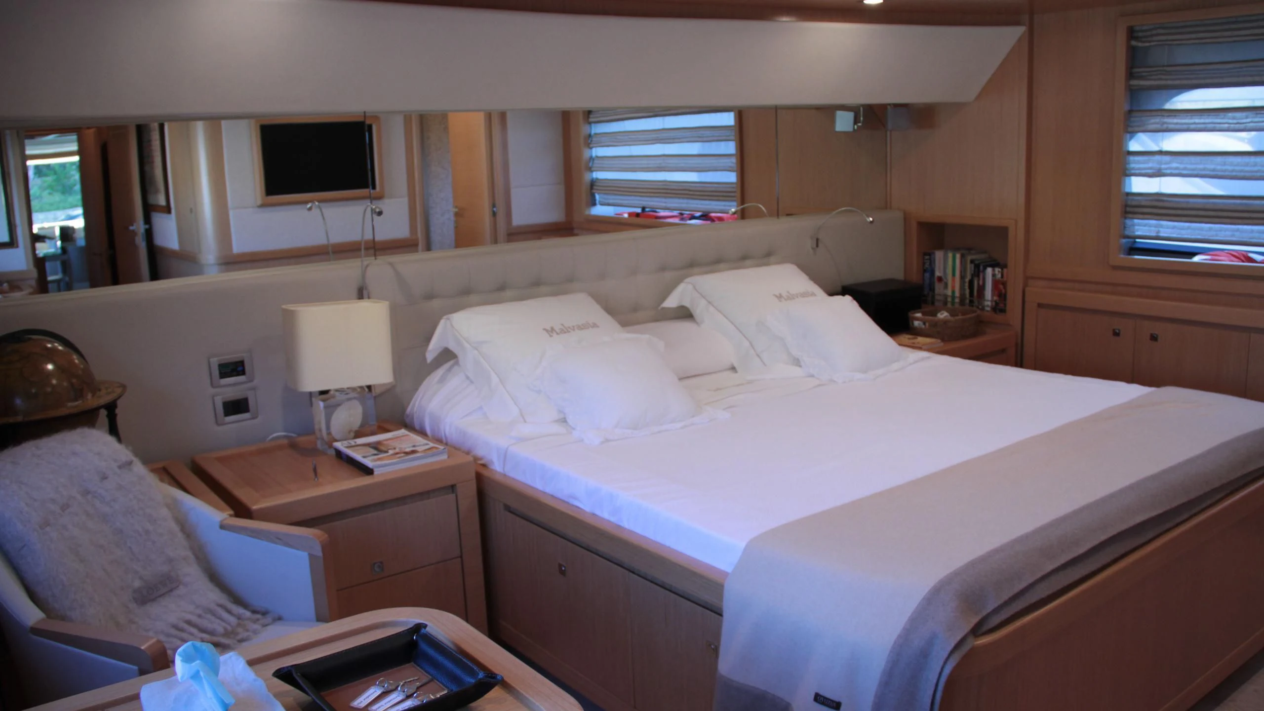 a bed with white sheets aboard EOLIA Yacht for Sale