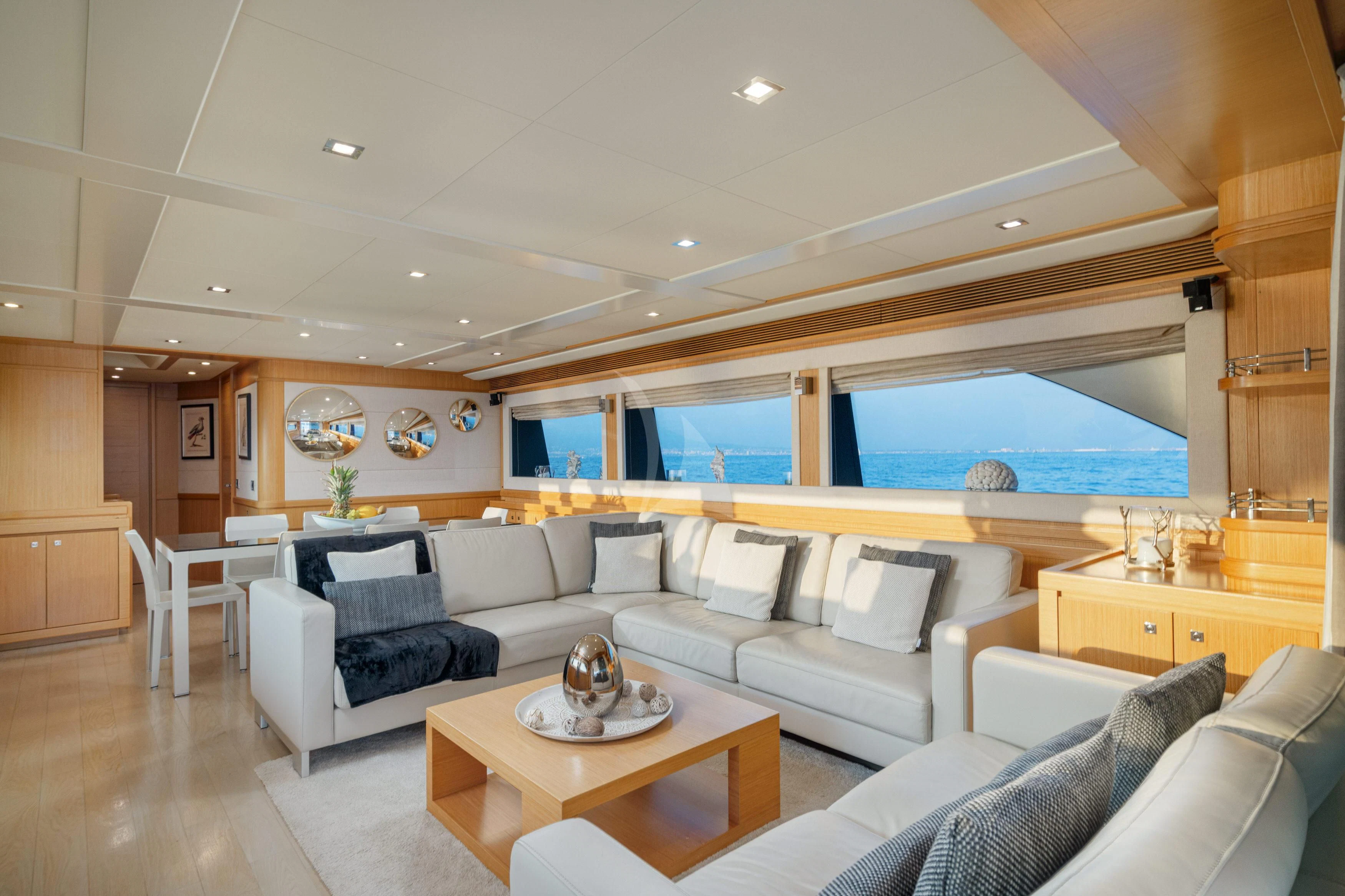 a living room with a large window aboard EOLIA Yacht for Sale