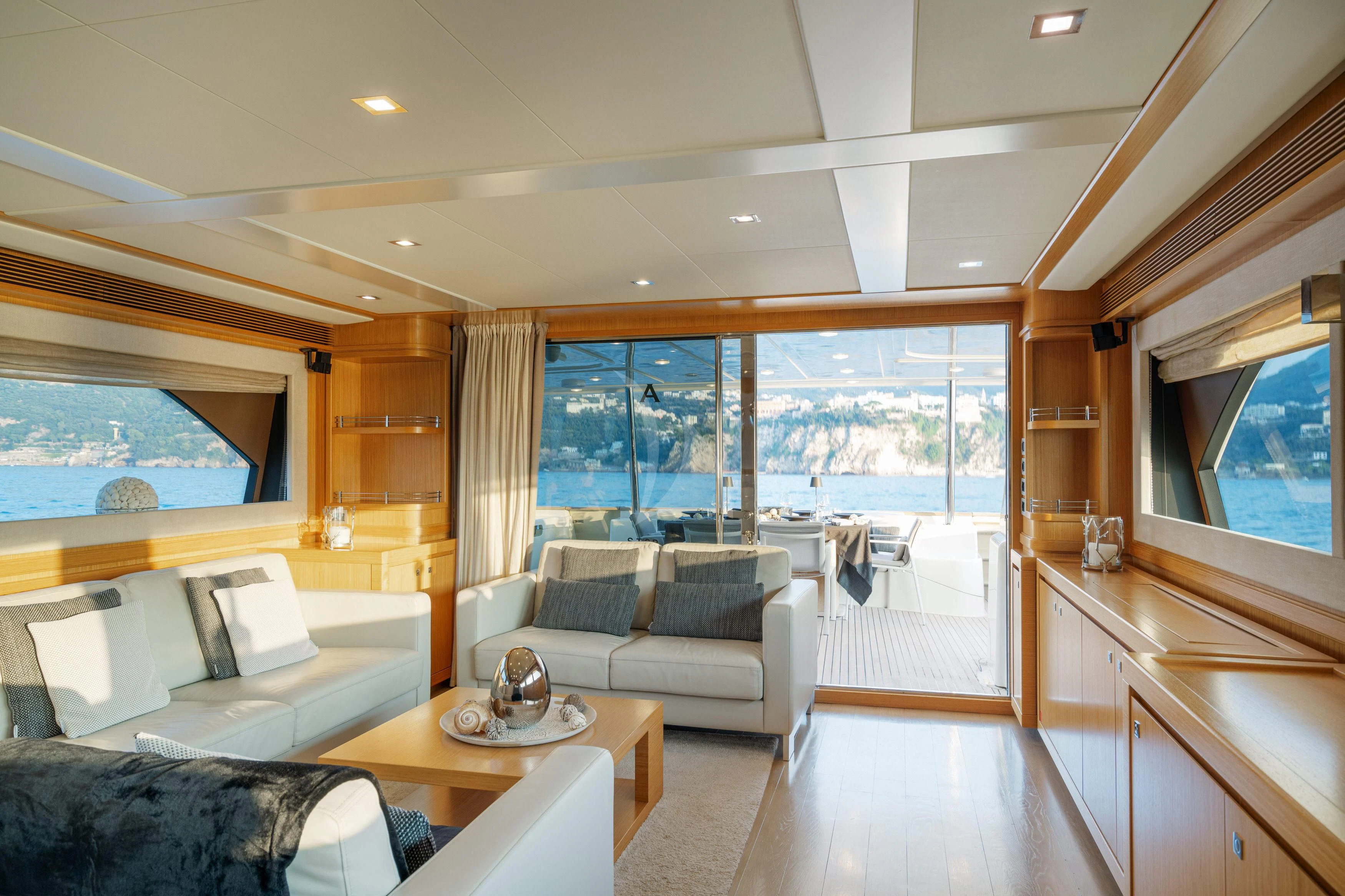 a living room with a large window aboard EOLIA Yacht for Sale