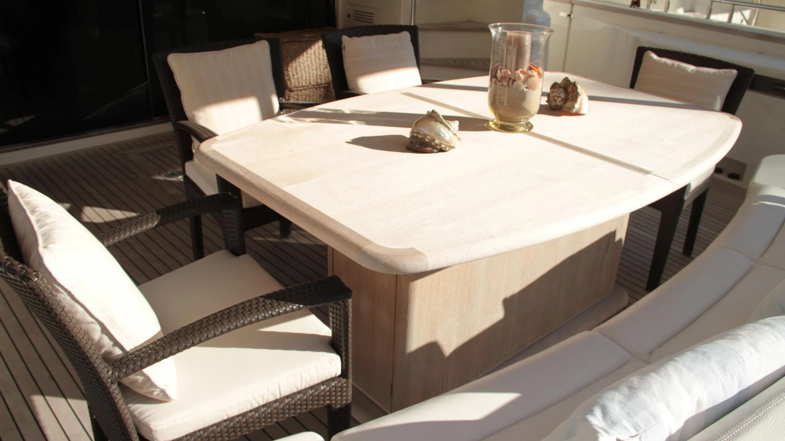 a table with chairs around it aboard EOLIA Yacht for Sale