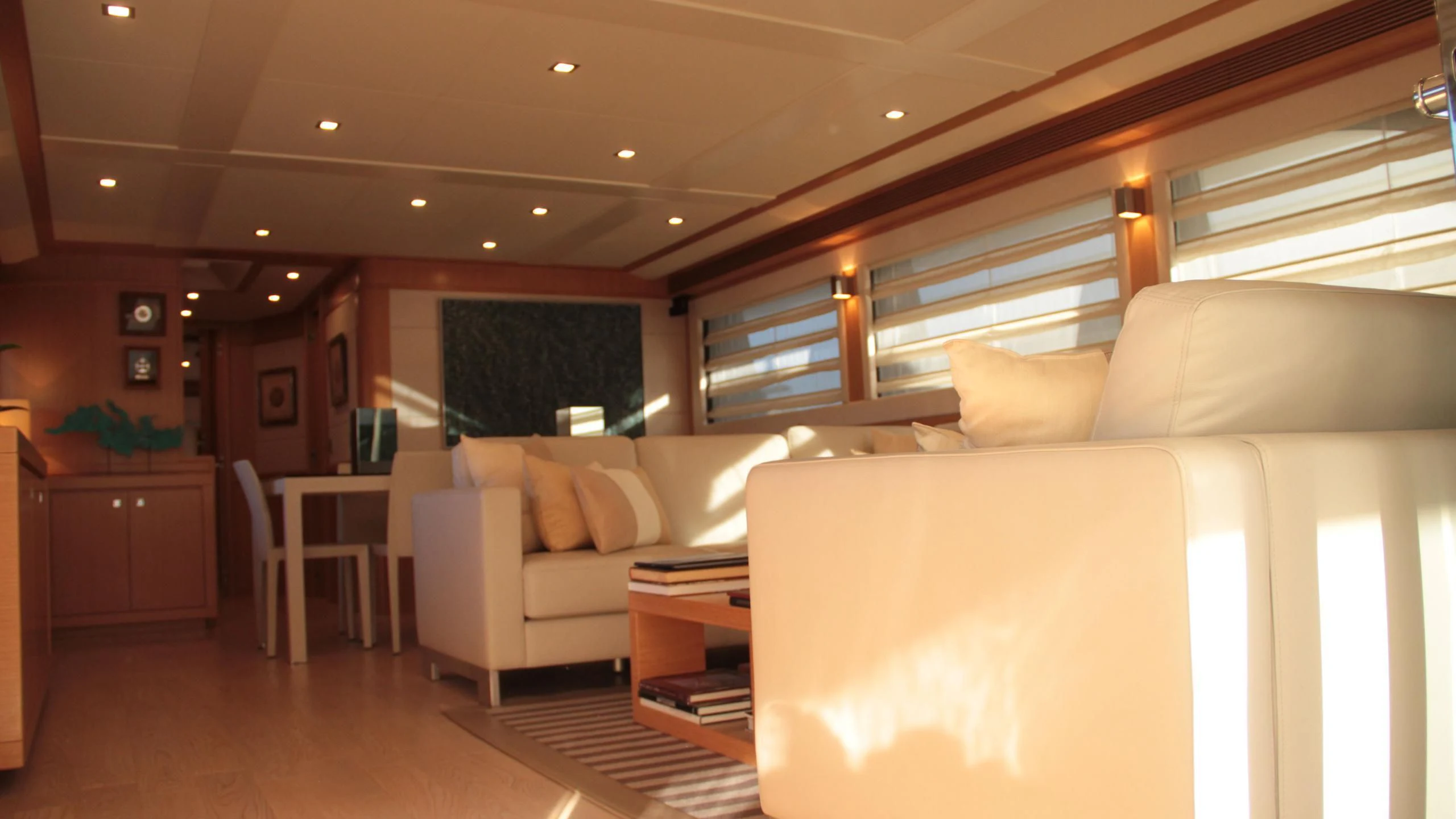 a living room with a couch and a table aboard EOLIA Yacht for Sale