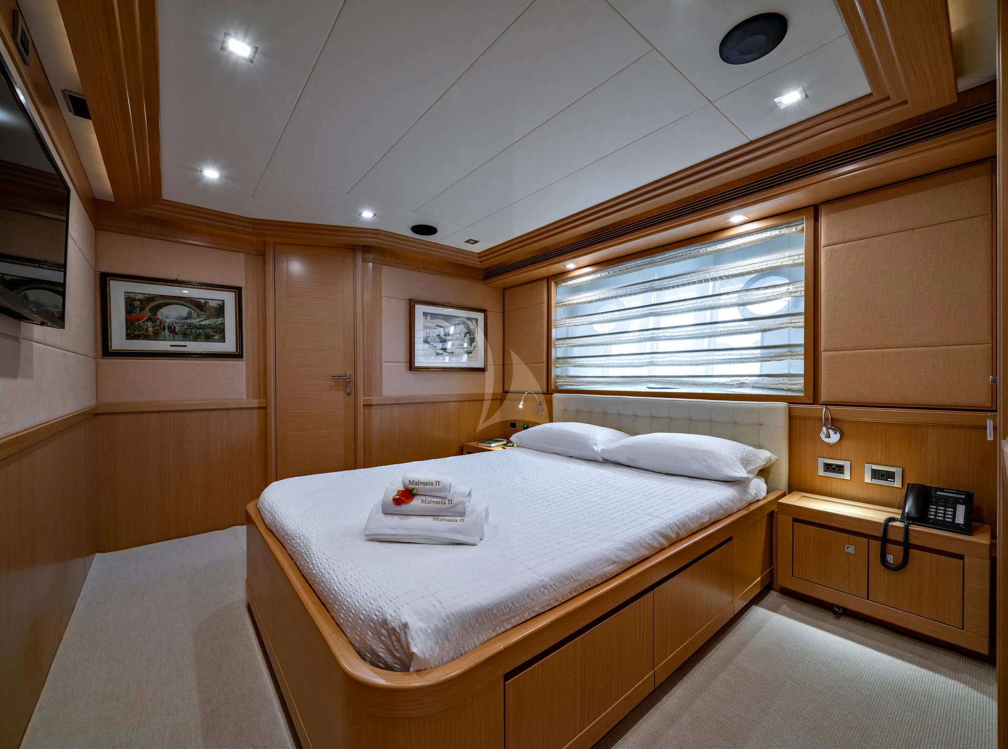 a room with a bed and a window aboard EOLIA Yacht for Sale