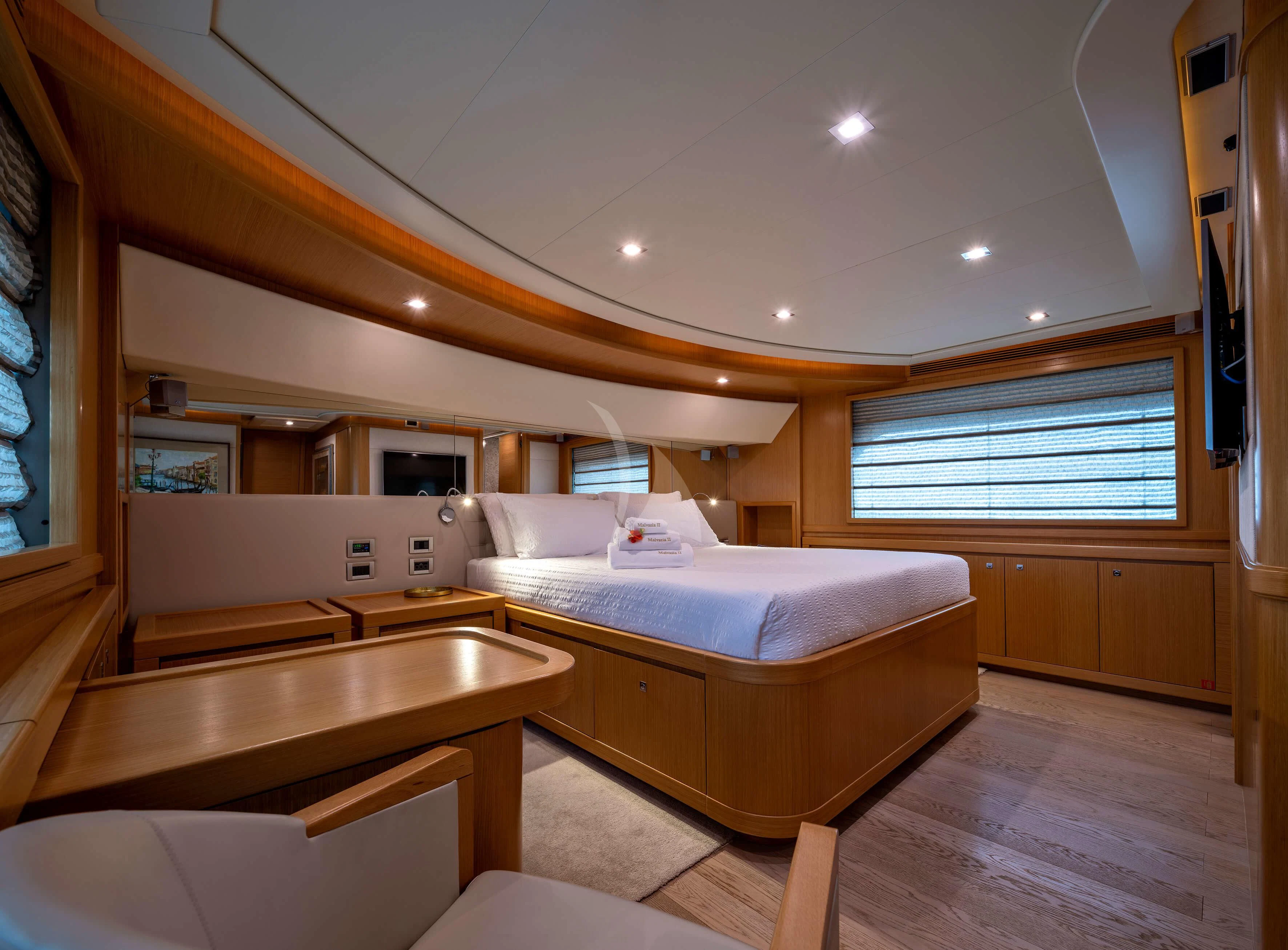 a bedroom with a bed and a sink aboard EOLIA Yacht for Sale
