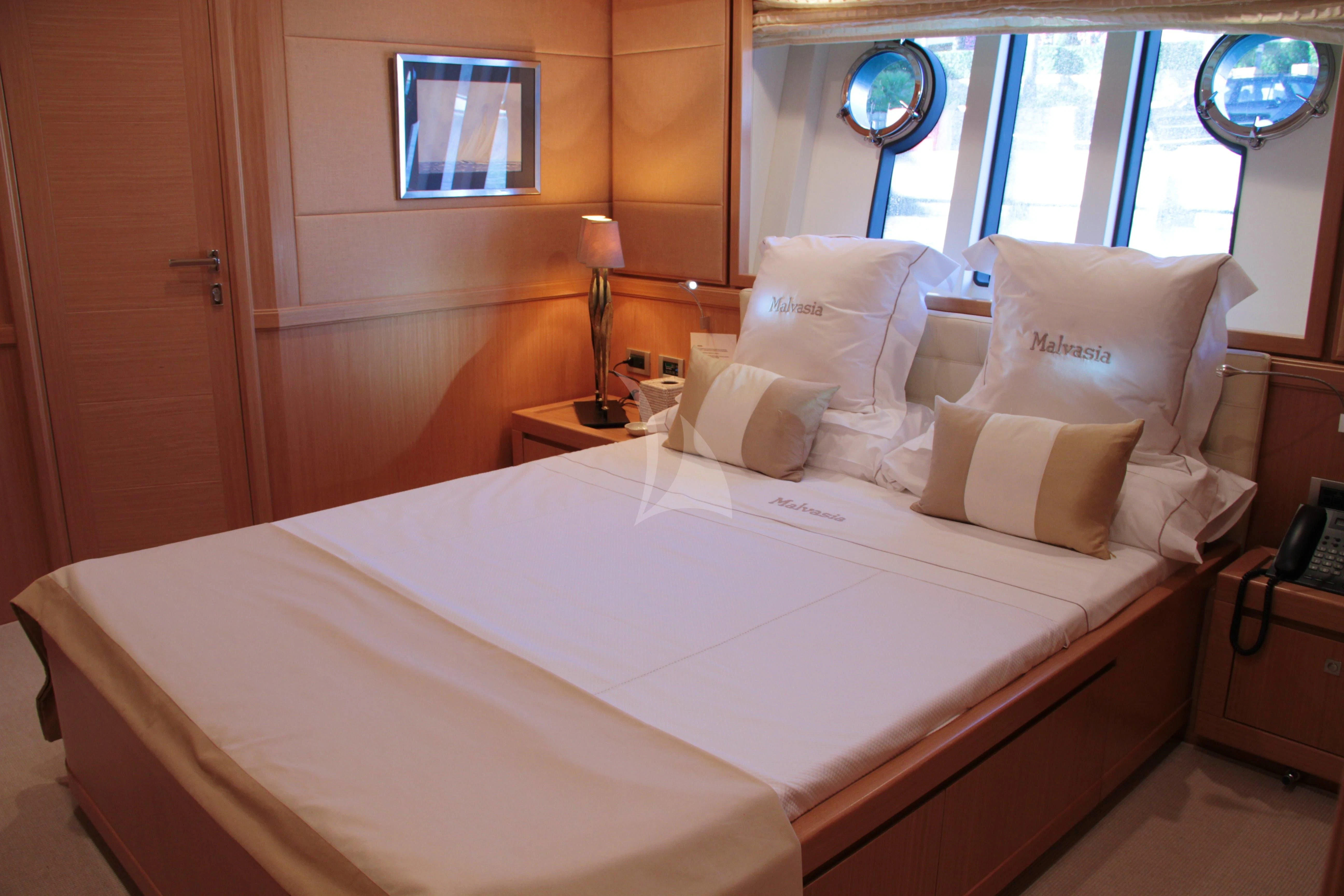 a room with a bed and a window aboard EOLIA Yacht for Sale