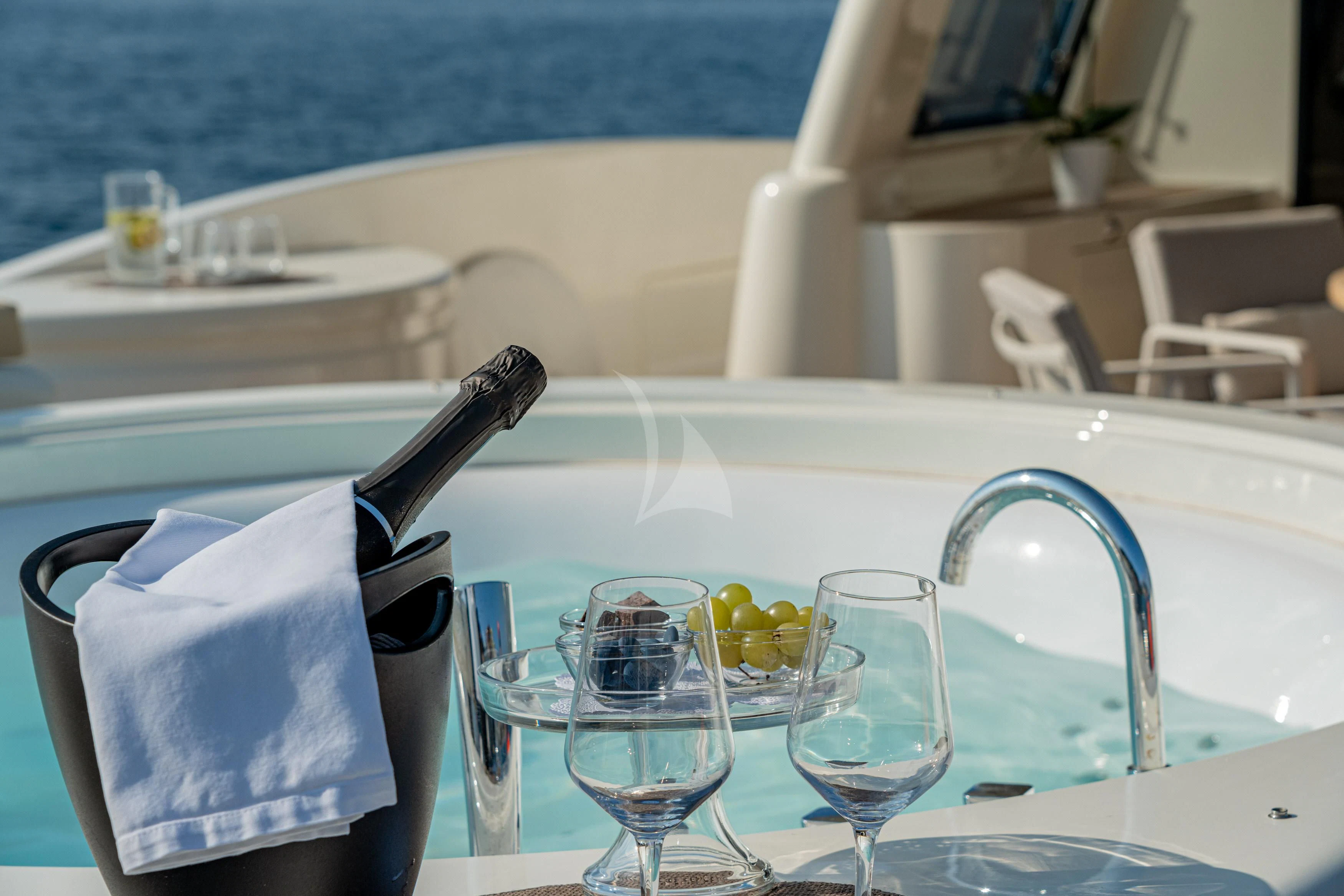 a table with glasses and a towel on it aboard EOLIA Yacht for Sale