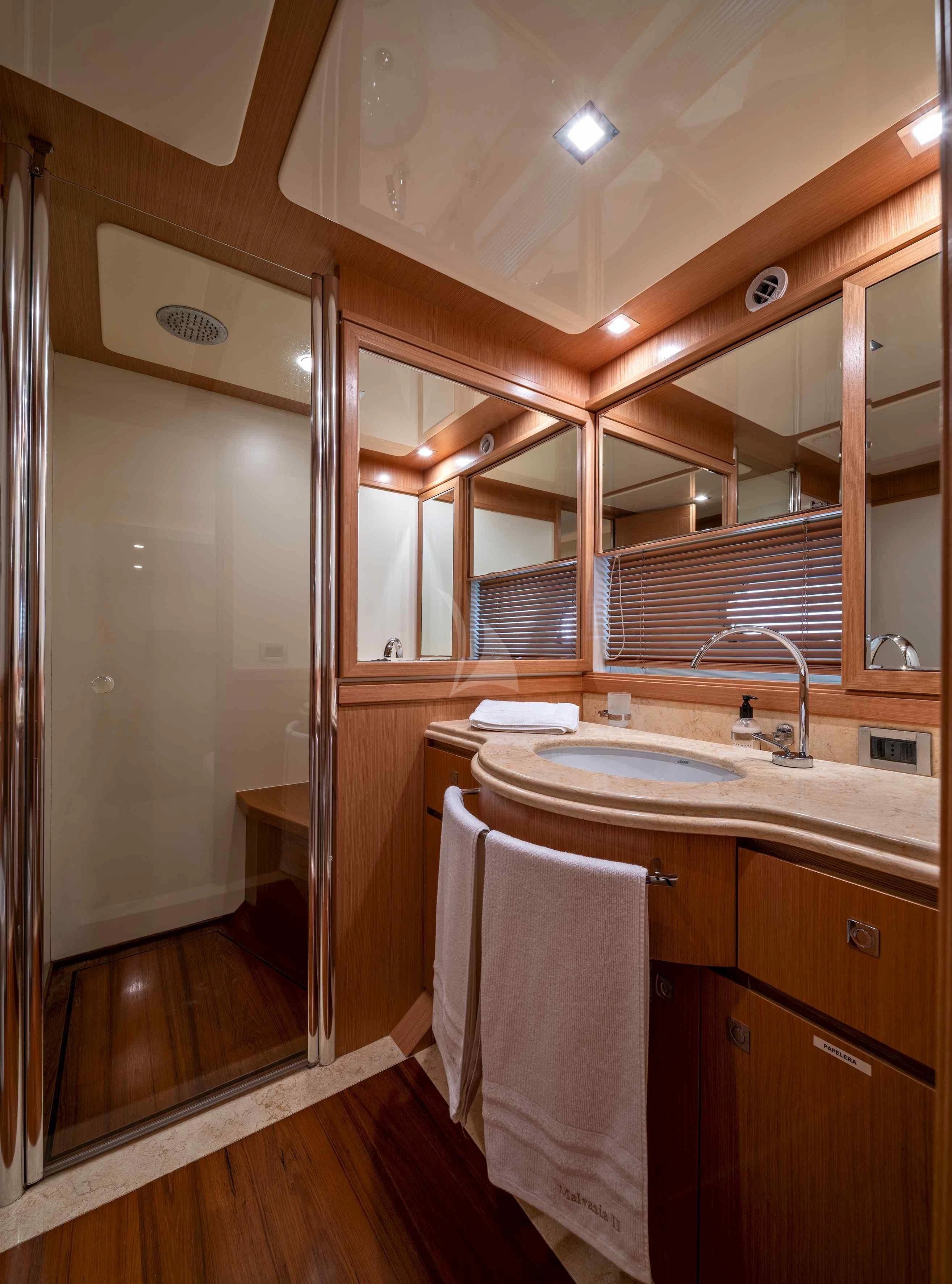 a bathroom with a sink and a shower unit aboard EOLIA Yacht for Sale