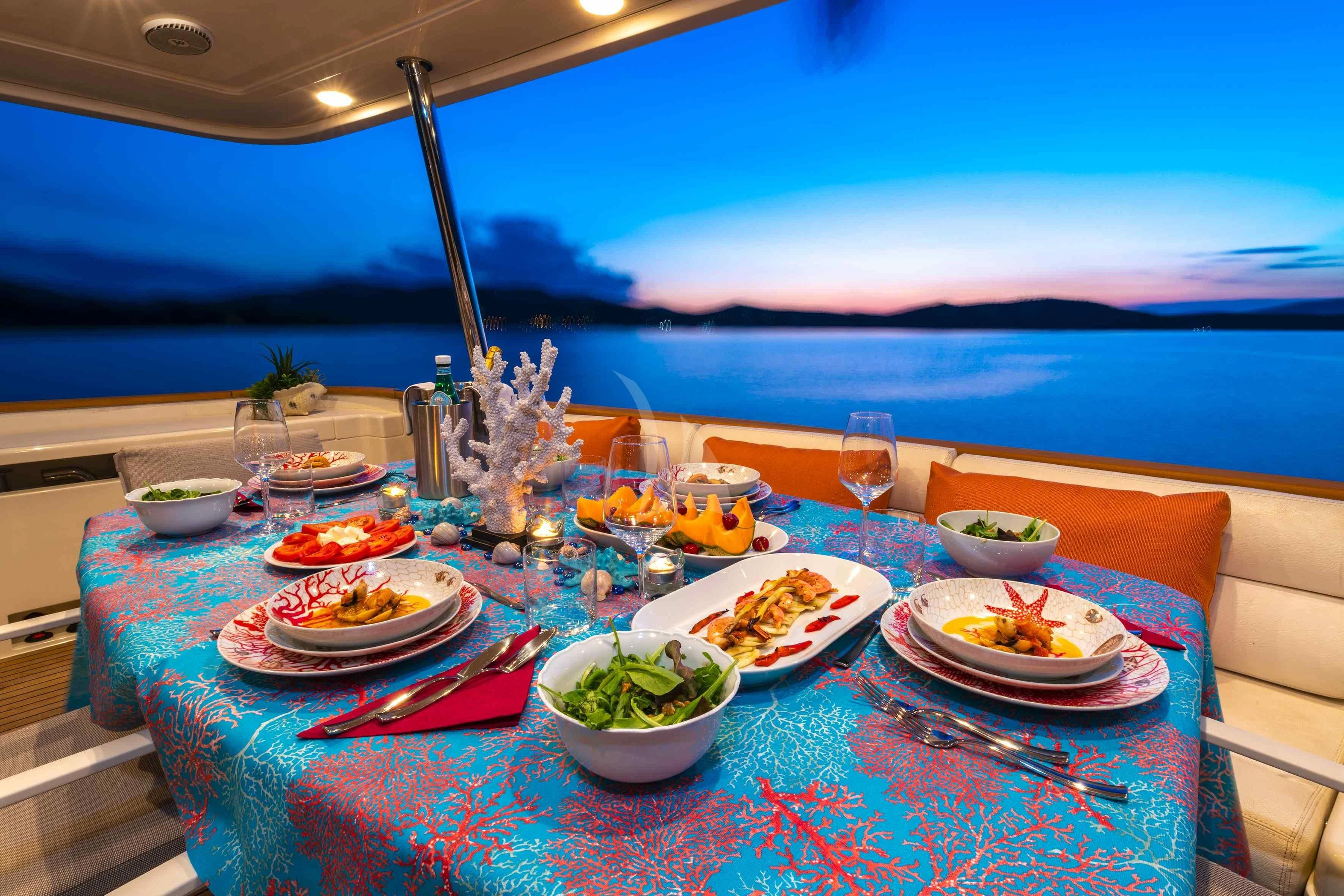 a table with food on it aboard EOLIA Yacht for Sale