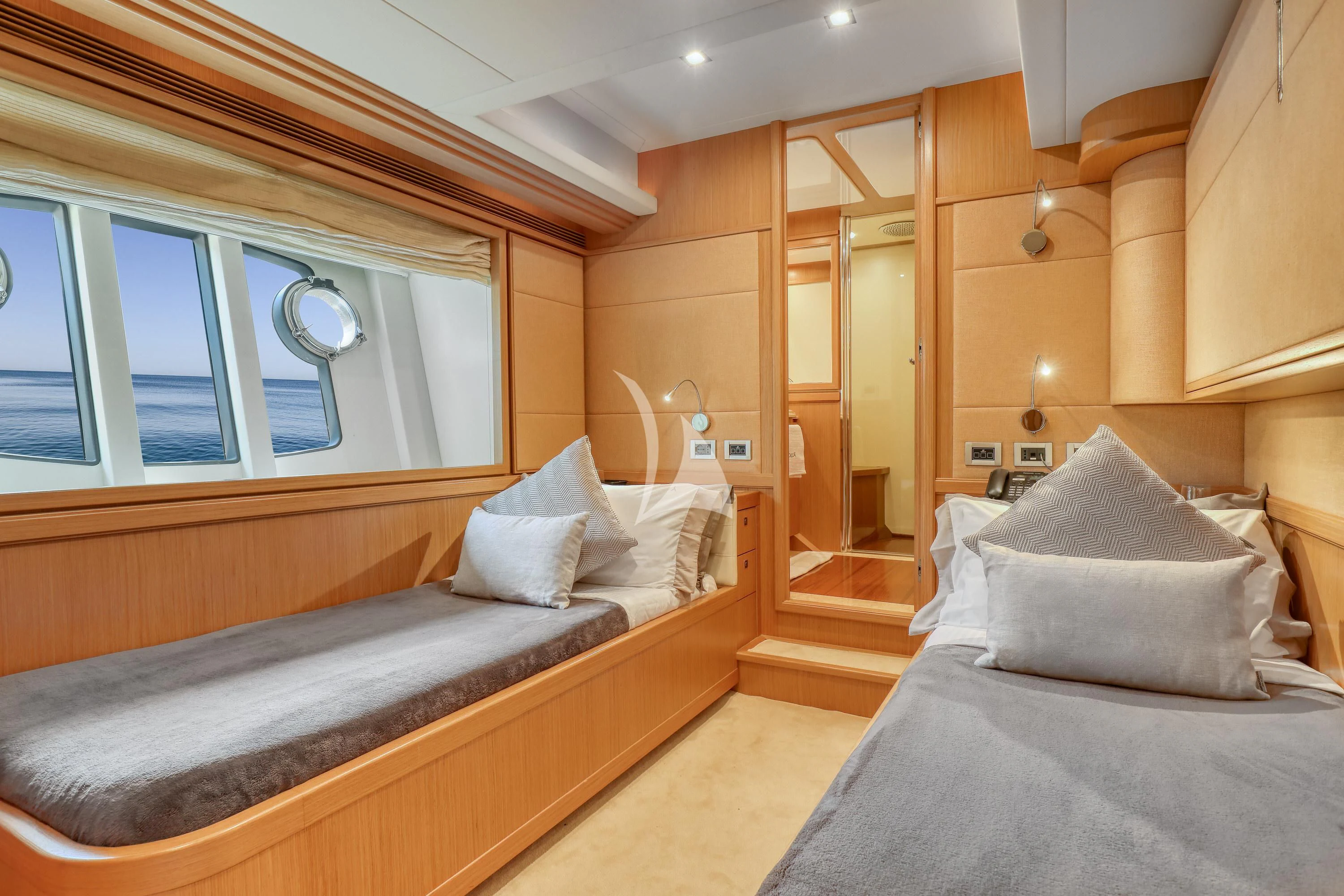 a room with a bed and a window aboard EOLIA Yacht for Sale