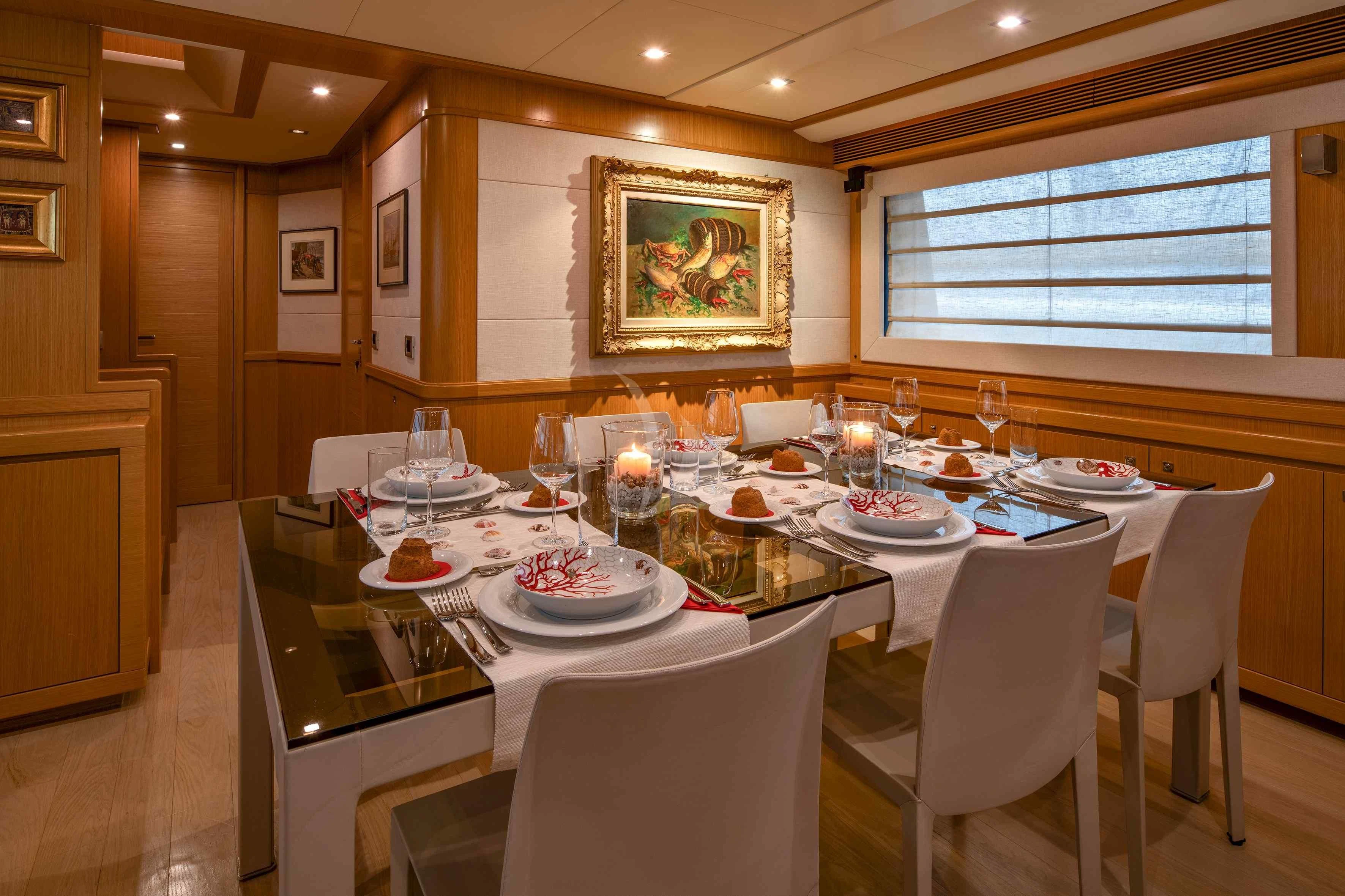 a table set for a dinner aboard EOLIA Yacht for Sale