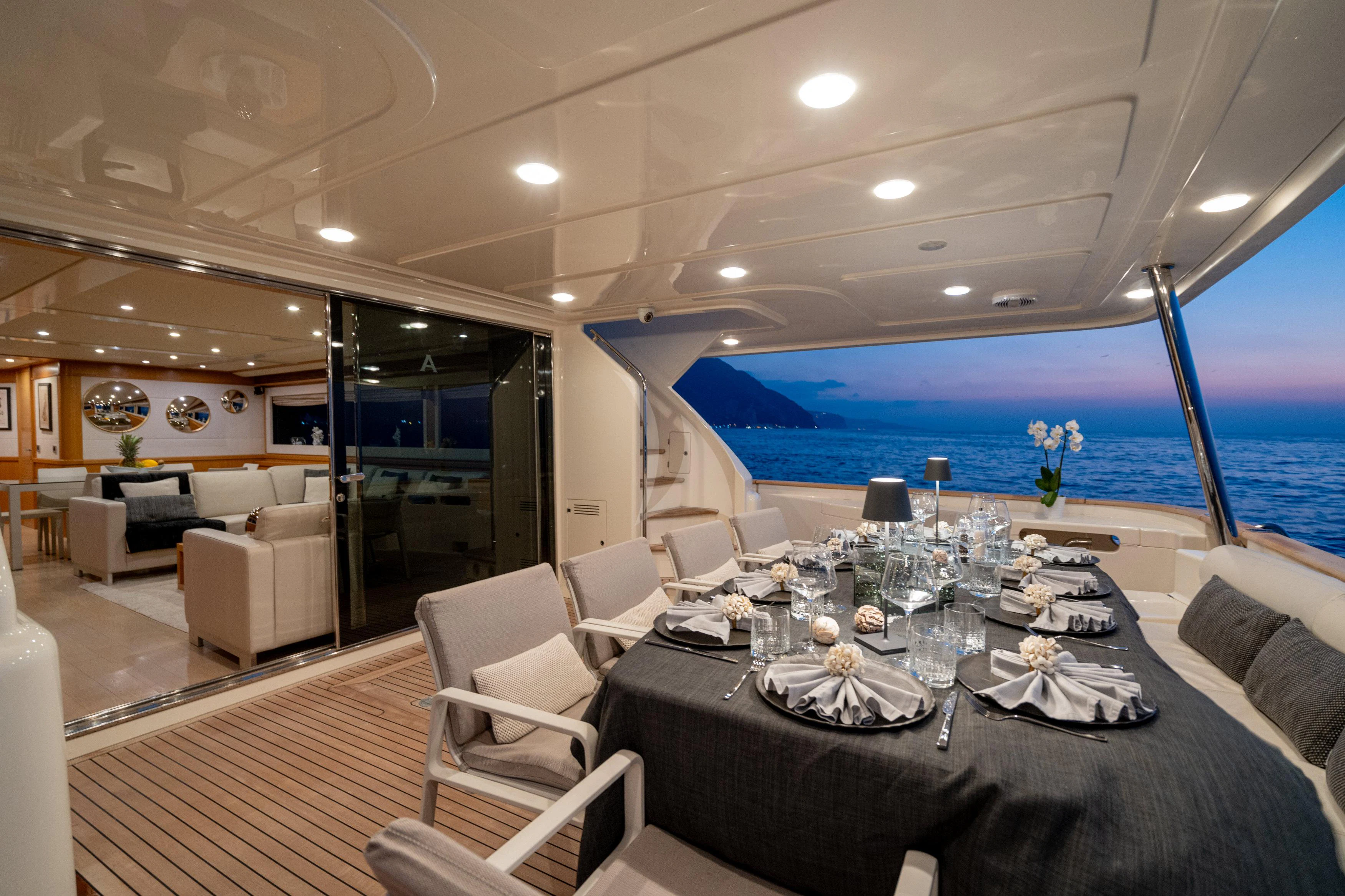 a large dining room with a large table and chairs aboard EOLIA Yacht for Sale