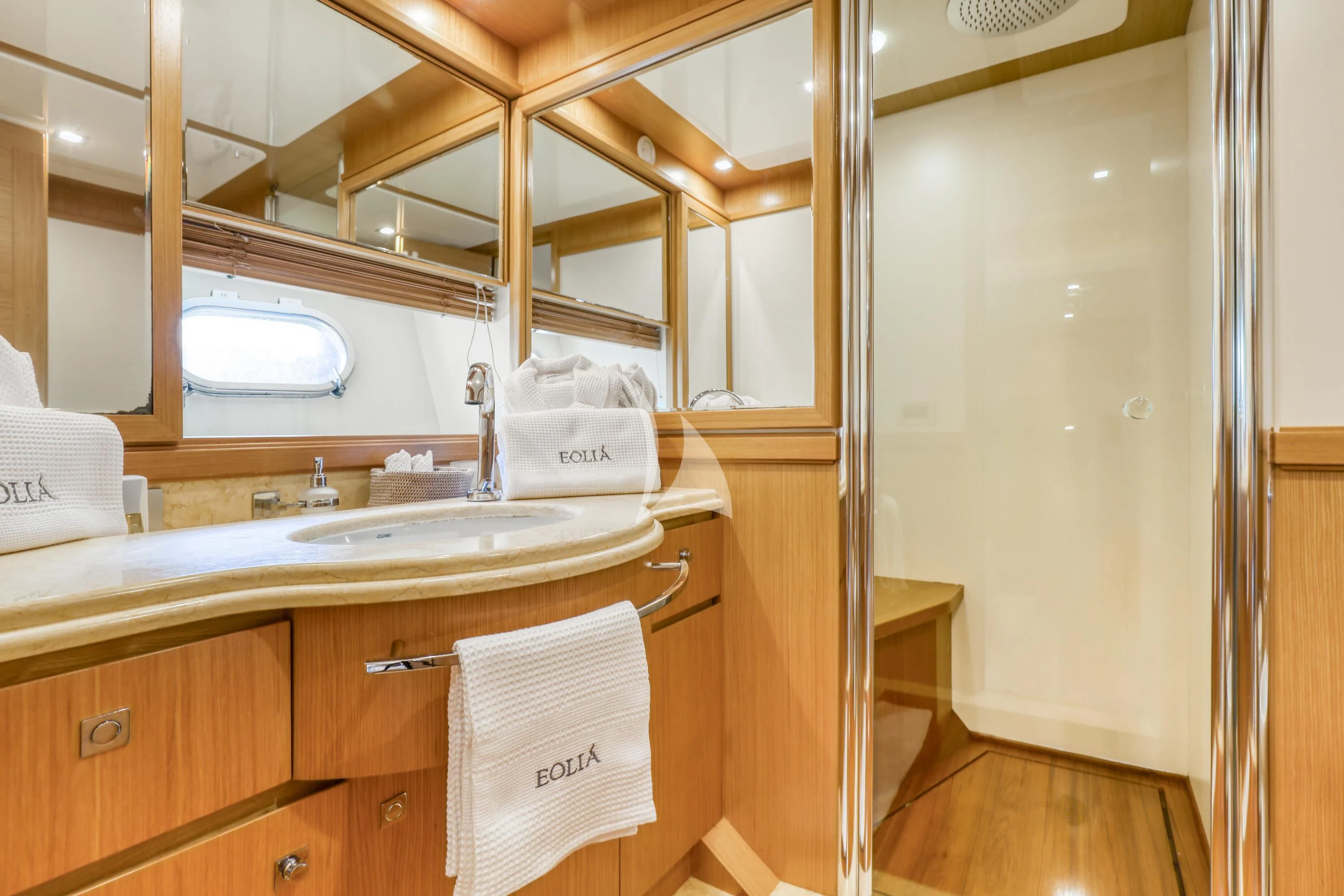a bathroom with a sink and cabinets aboard EOLIA Yacht for Sale