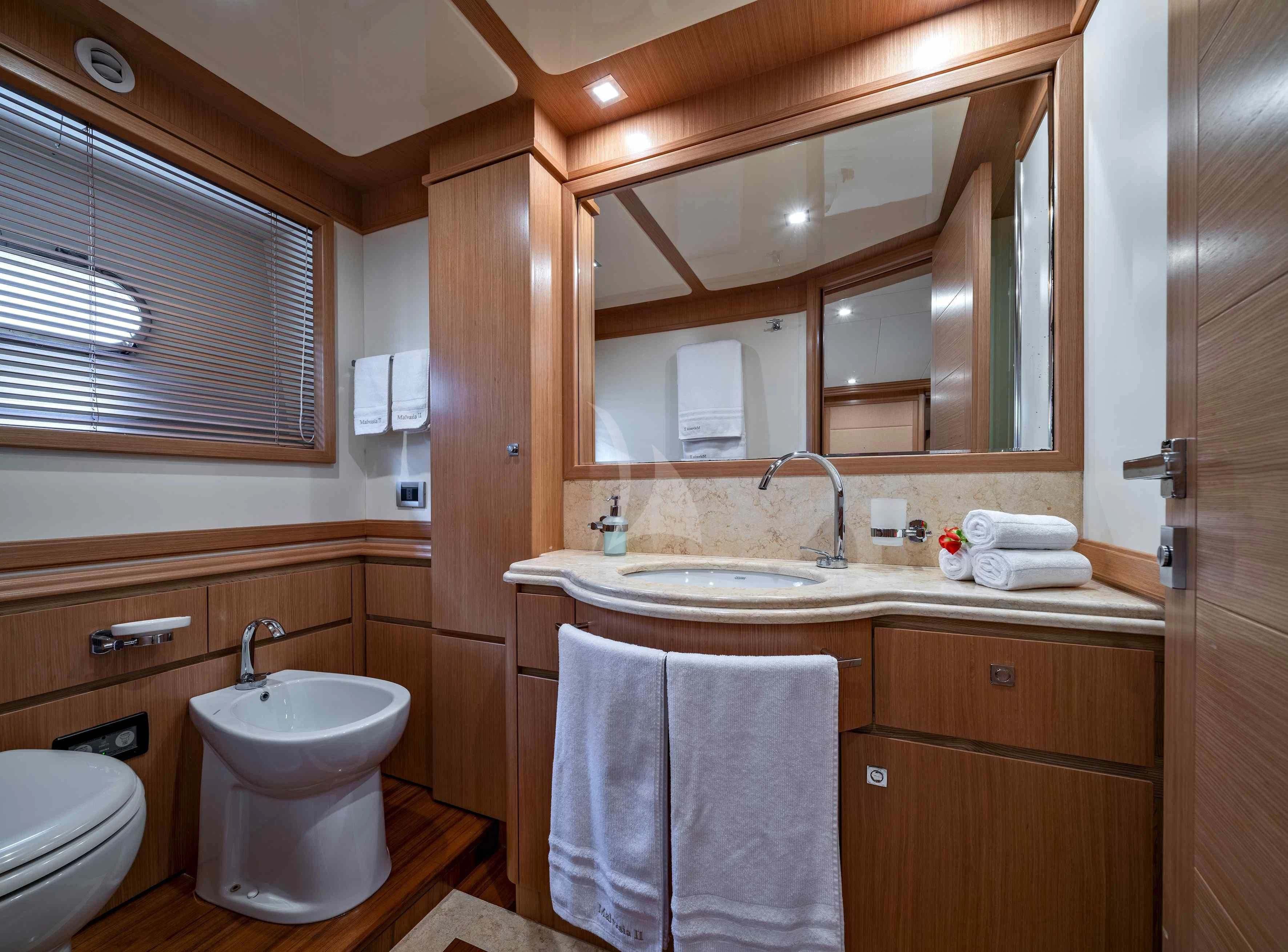 a bathroom with a sink and a toilet aboard EOLIA Yacht for Sale