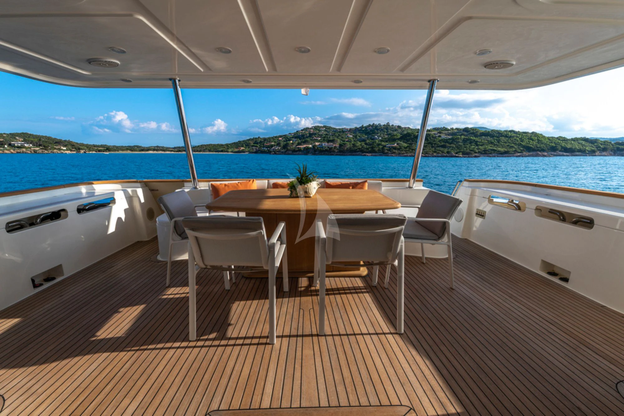 a table and chairs on a deck aboard EOLIA Yacht for Sale