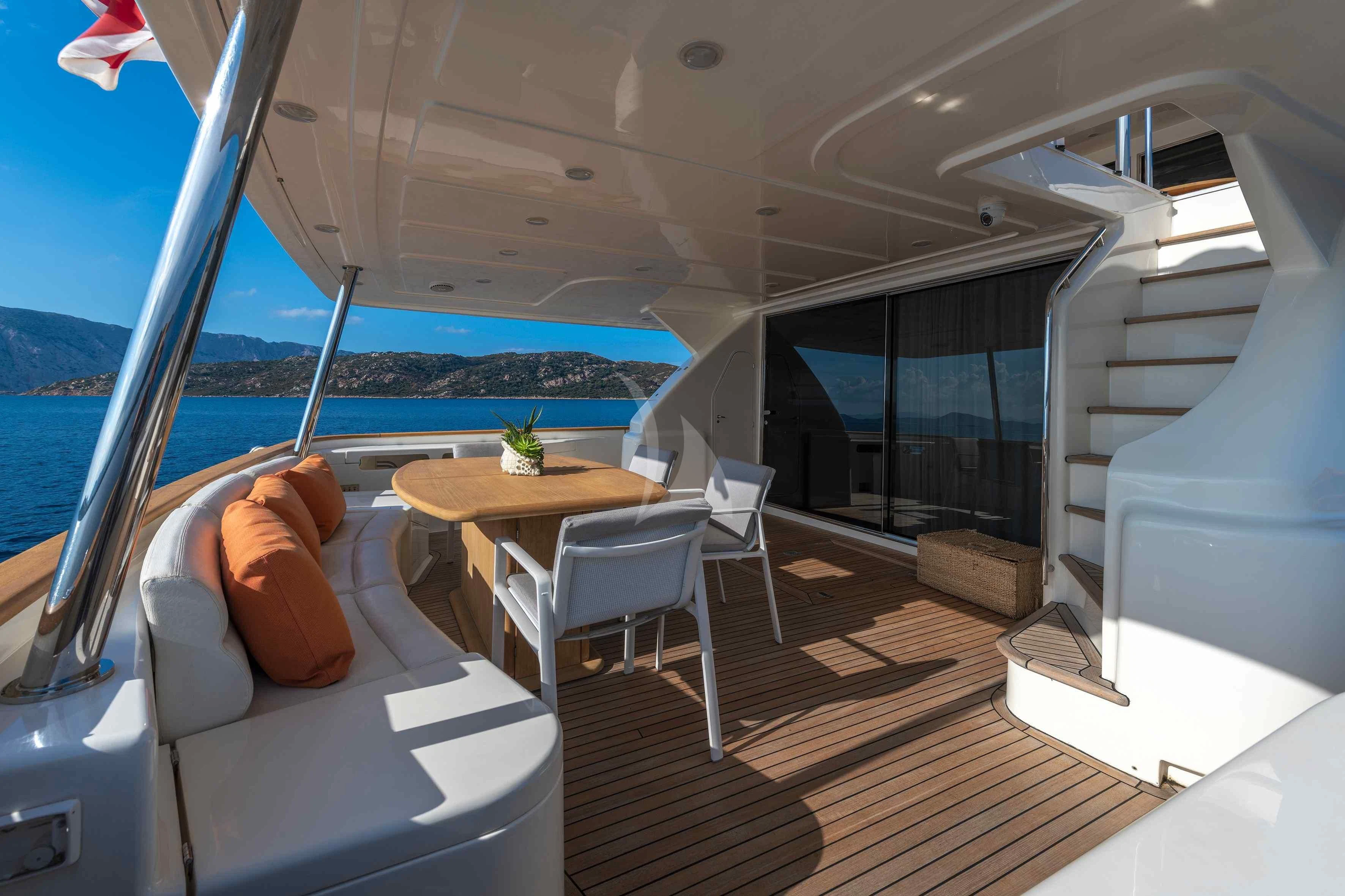 a boat with a table and chairs aboard EOLIA Yacht for Sale