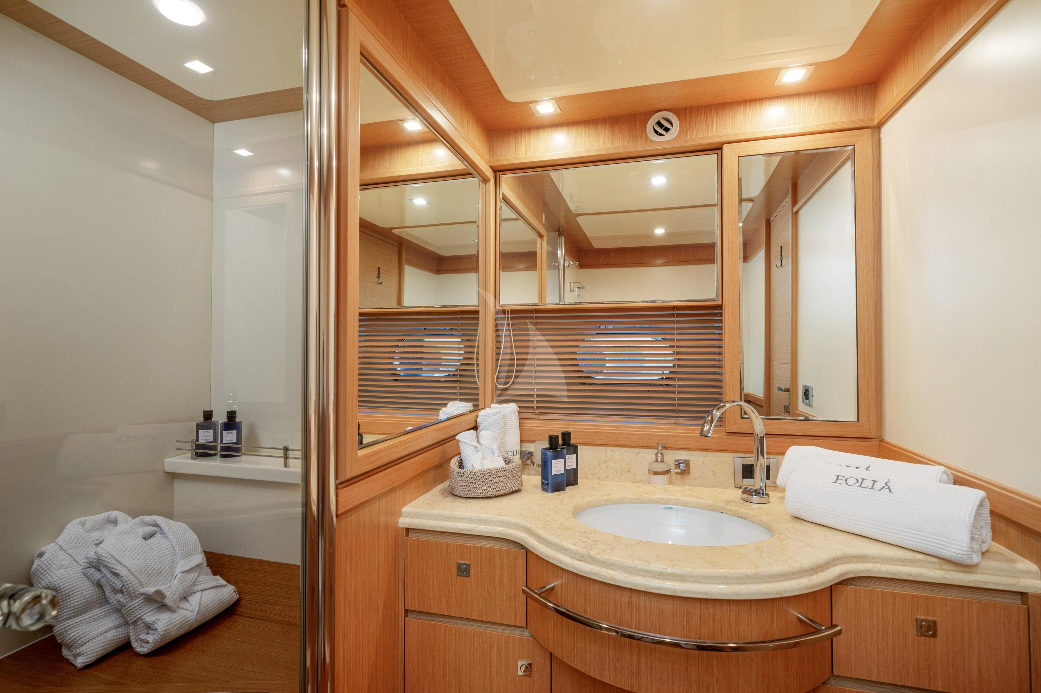 a bathroom with a large mirror aboard EOLIA Yacht for Sale