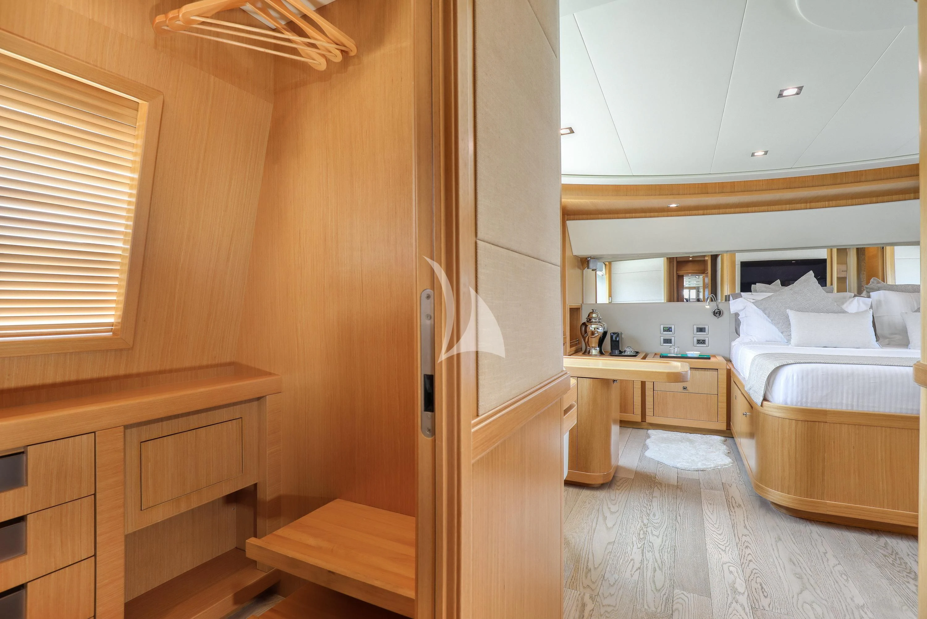 a room with a bed and a desk aboard EOLIA Yacht for Sale