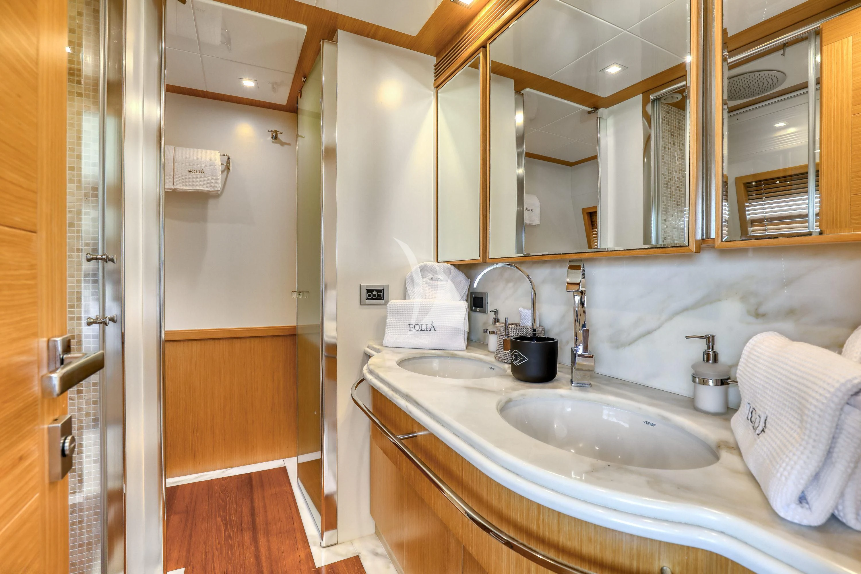 a bathroom with a sink and mirror aboard EOLIA Yacht for Sale