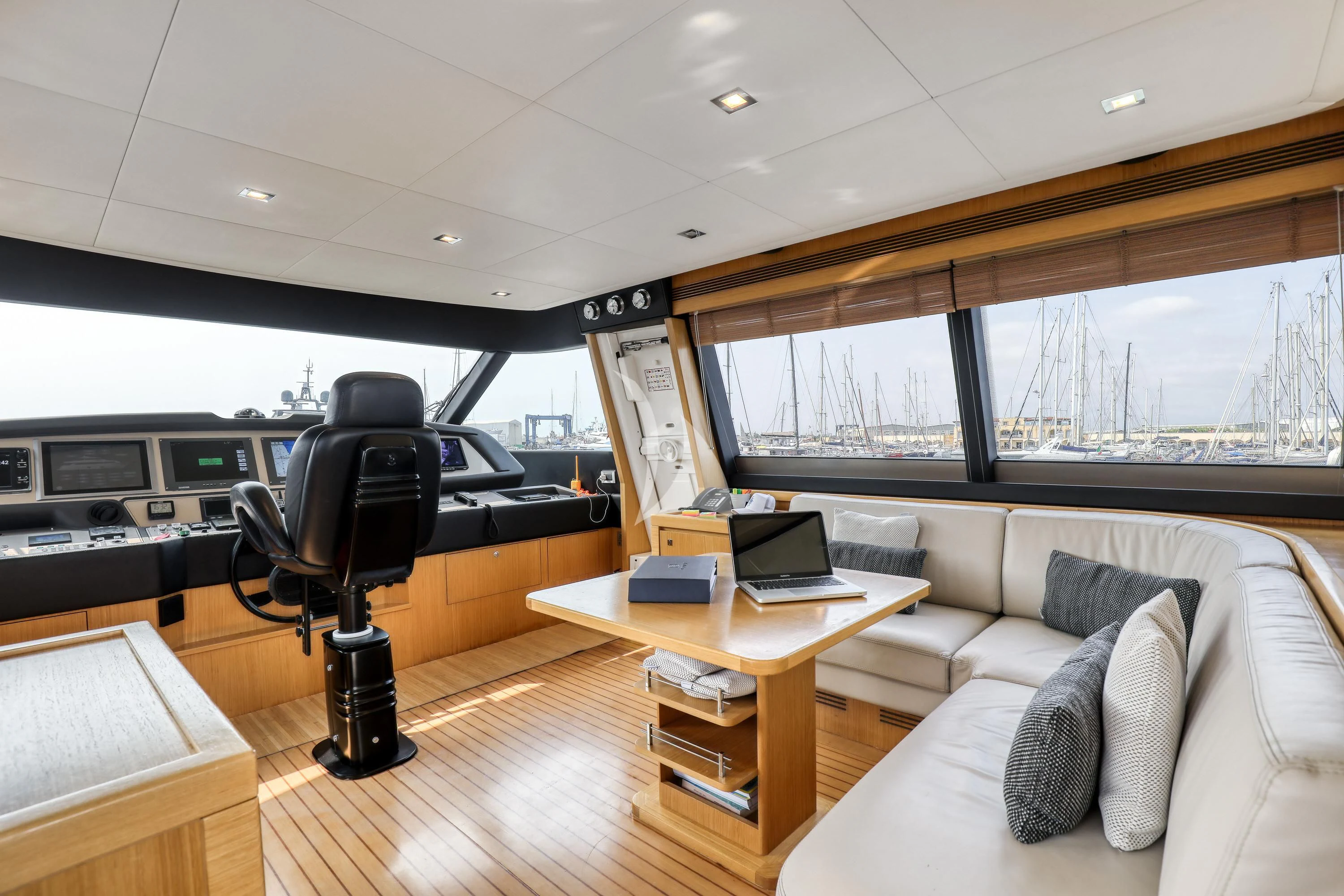 a room with a couch and a desk aboard EOLIA Yacht for Sale