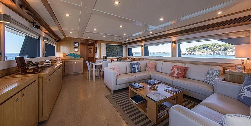 a living room with a couch and a table aboard EOLIA Yacht for Sale