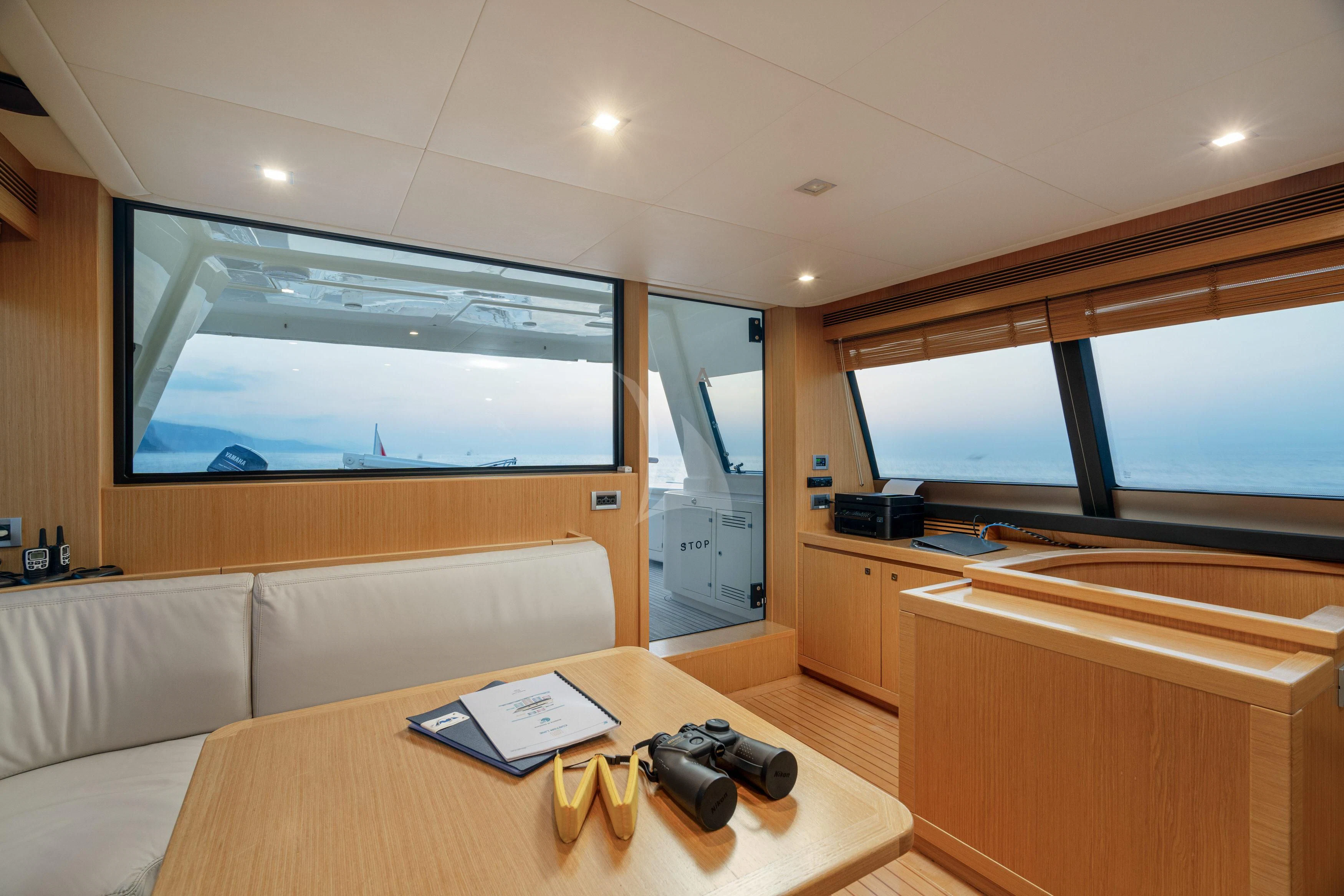 a living room with a couch and a tv aboard EOLIA Yacht for Sale